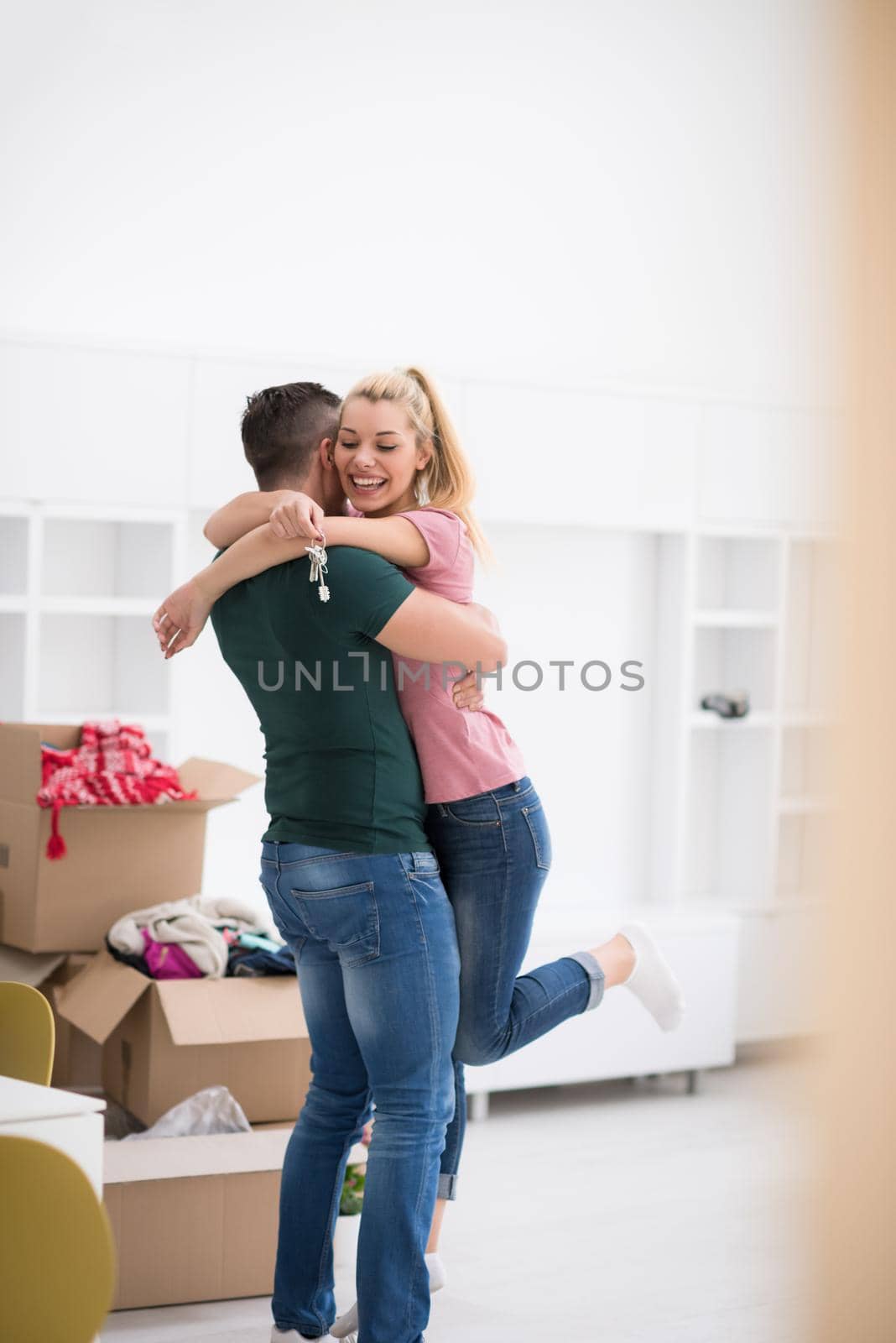 happy Young couple moving in new house by dotshock