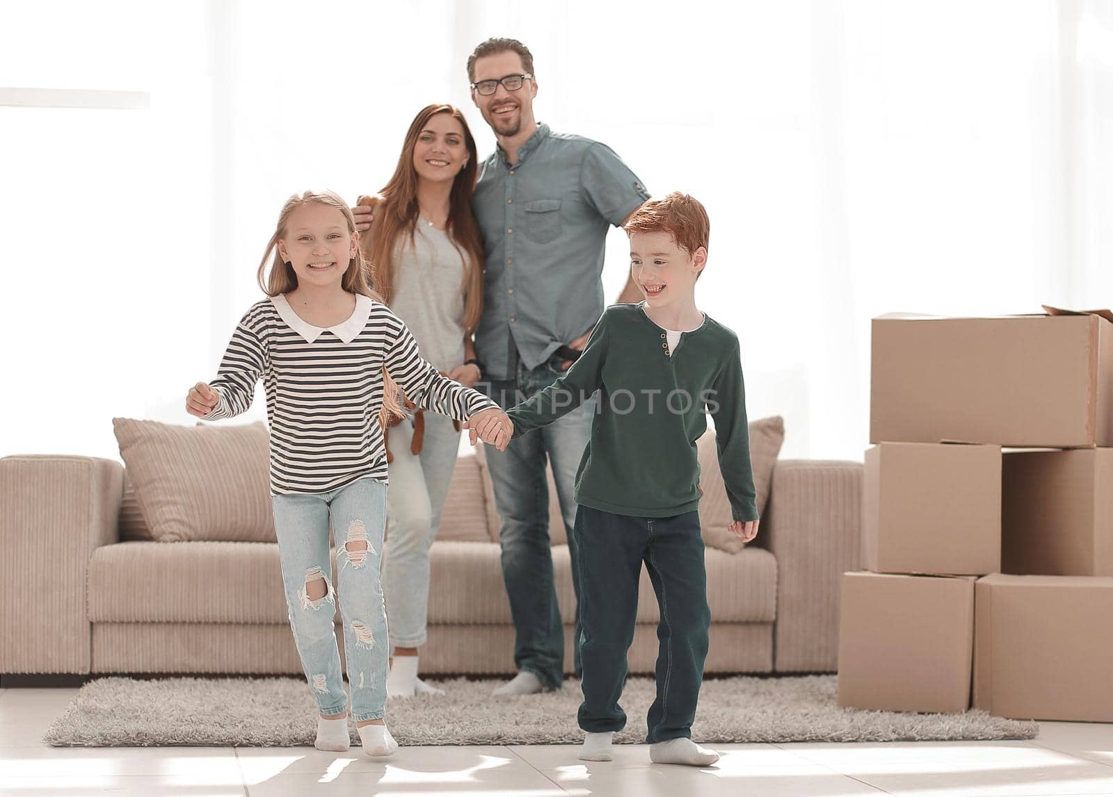 cheerful family in a new spacious apartment.photo with copy space