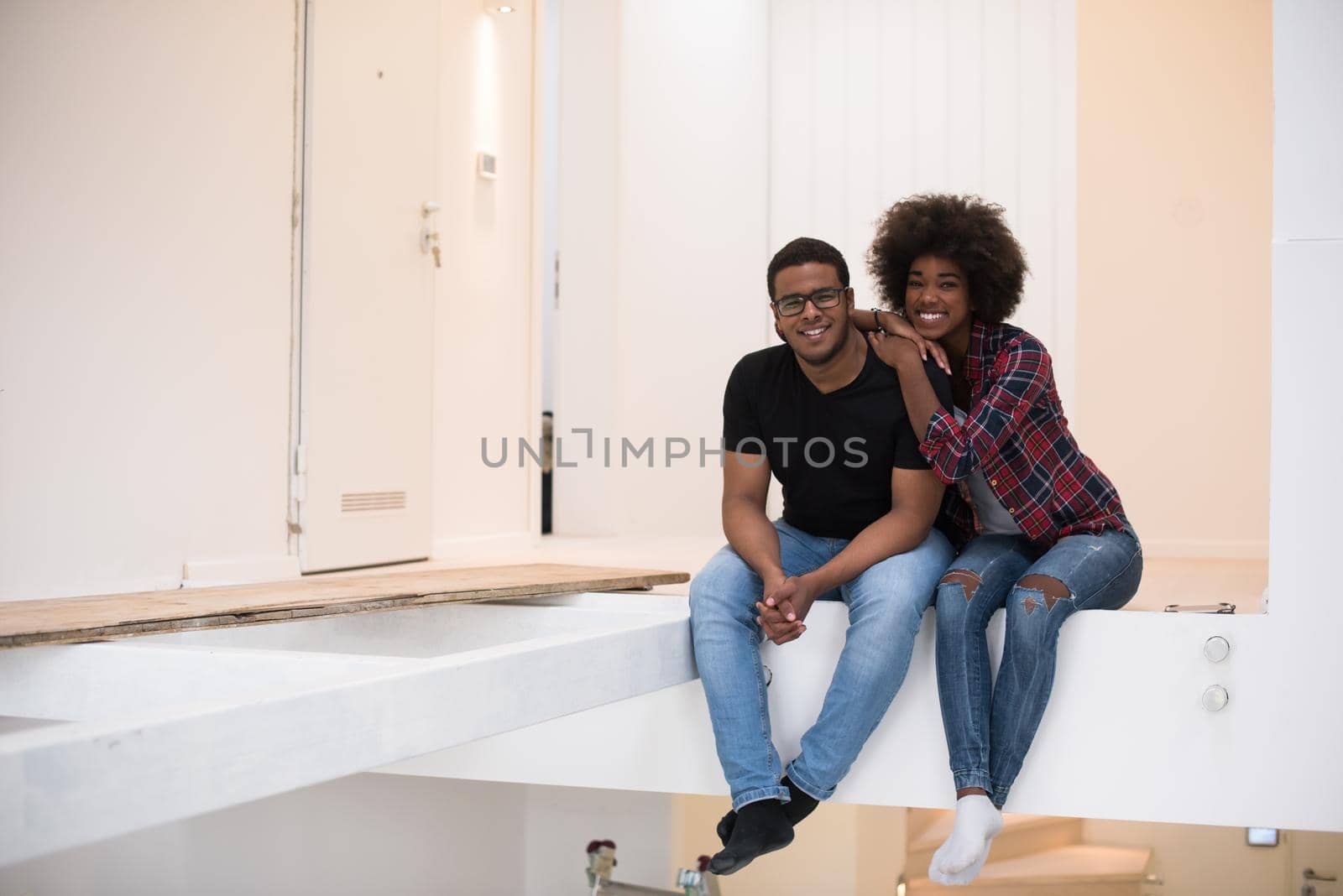 couple having break during moving to new house by dotshock