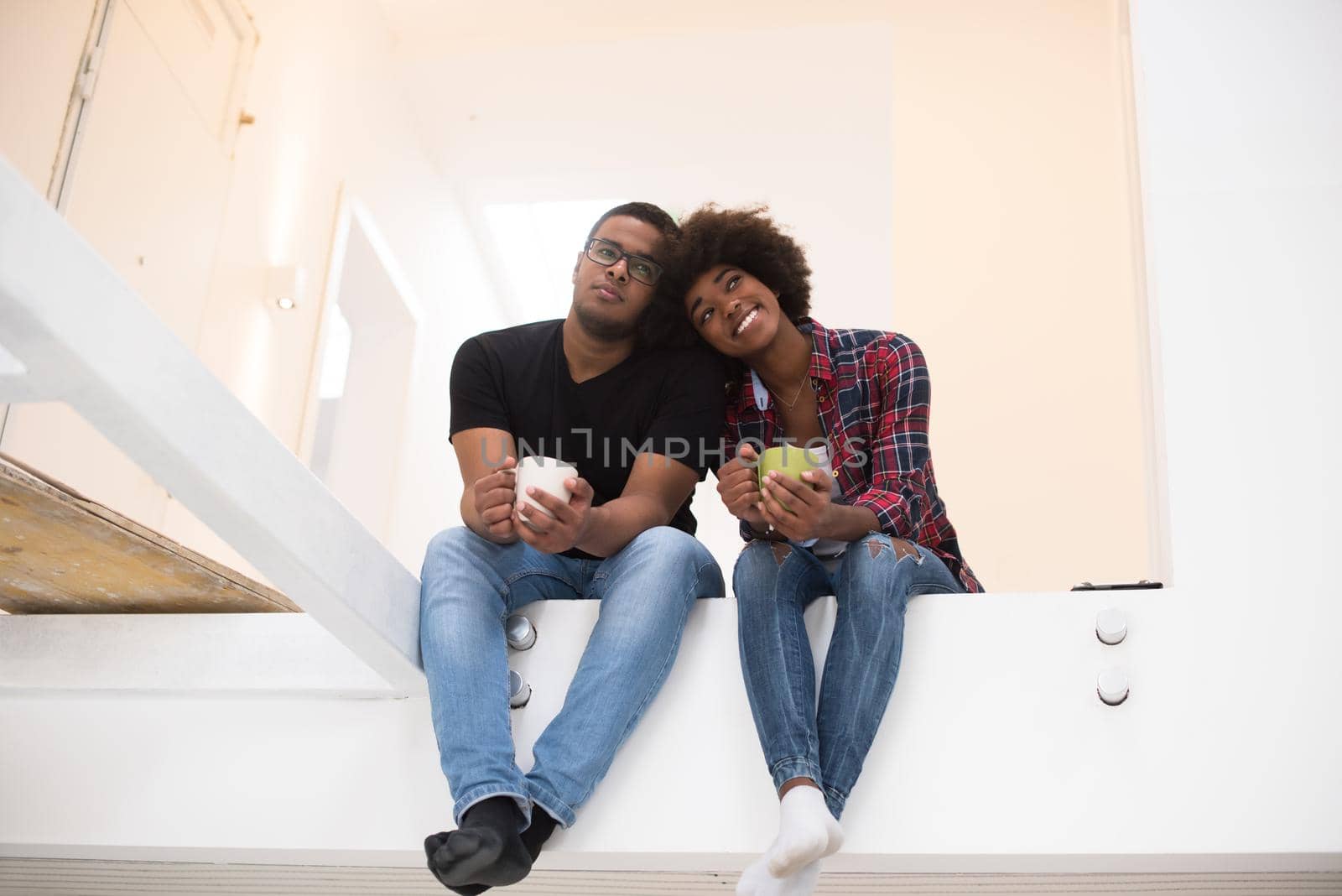 couple having break during moving to new house by dotshock