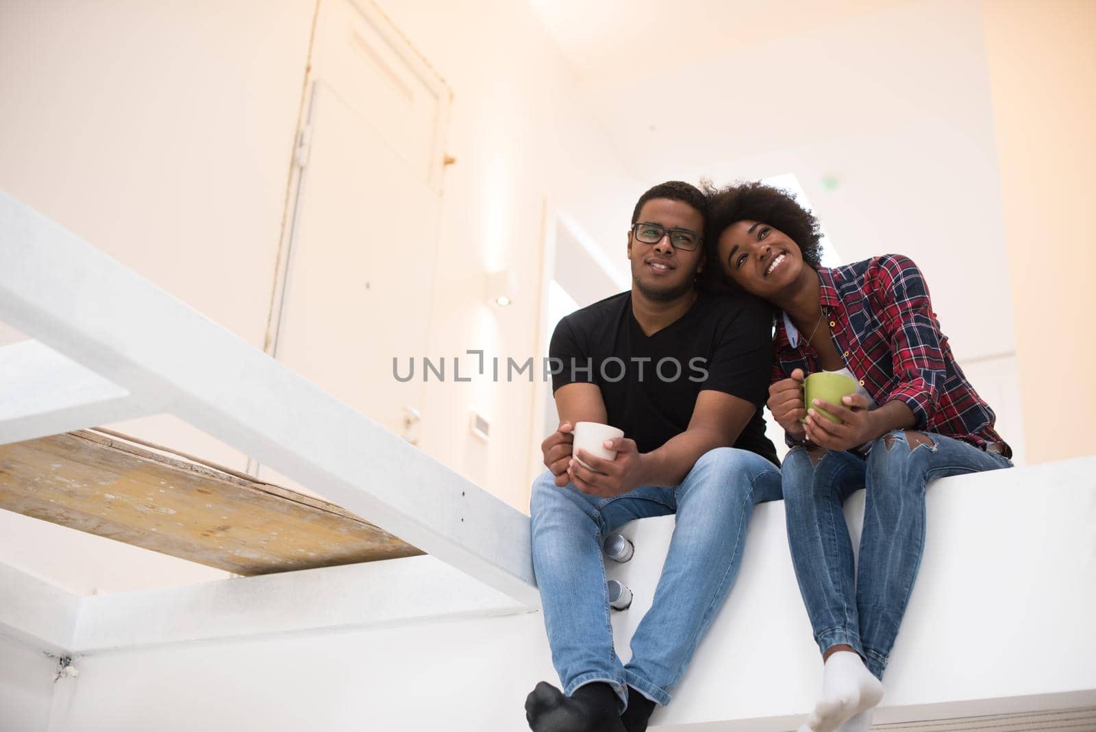 couple having break during moving to new house by dotshock