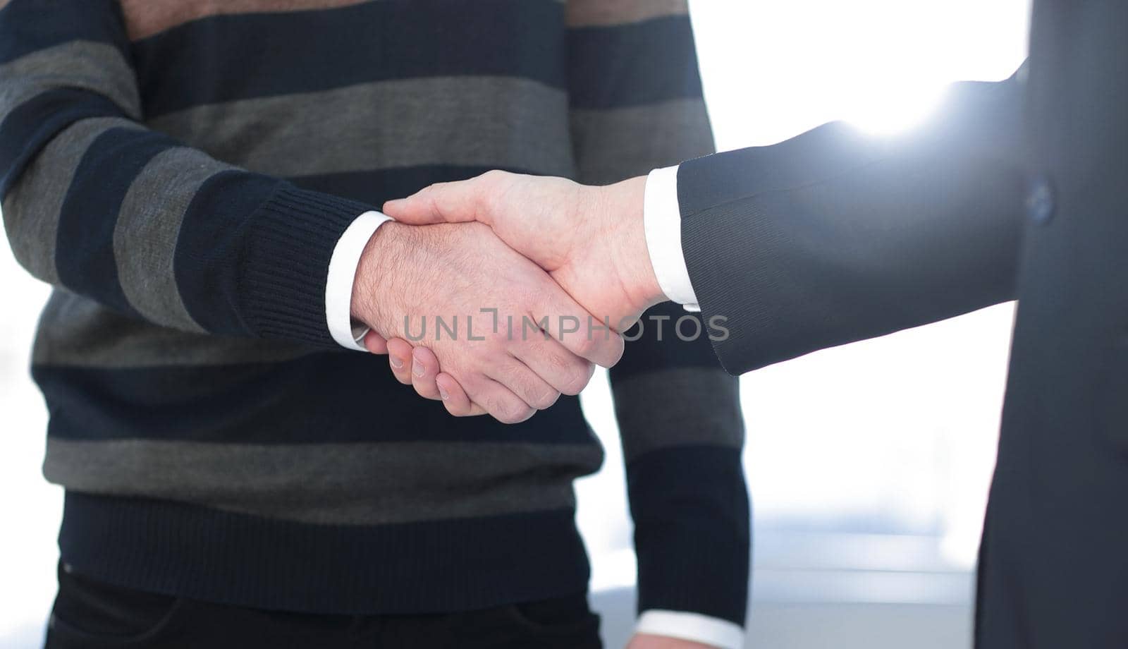 closeup.handshake business people by asdf