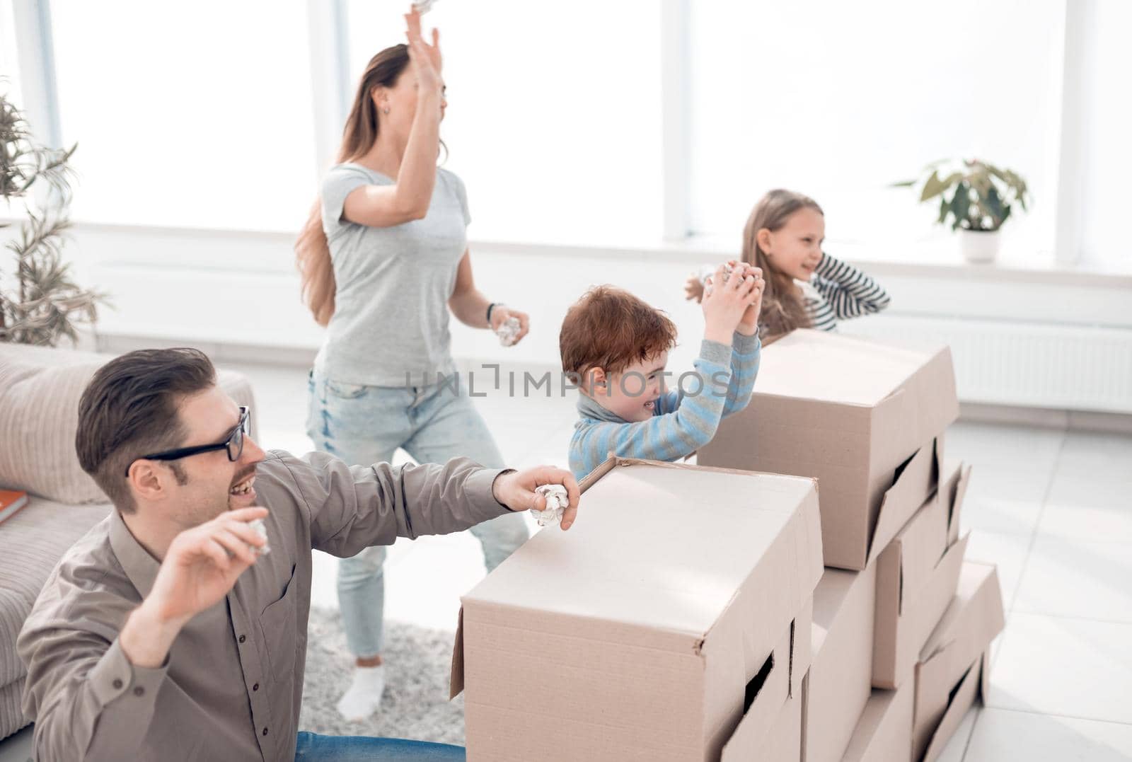 young family is having fun in a new apartment.photo with copy space