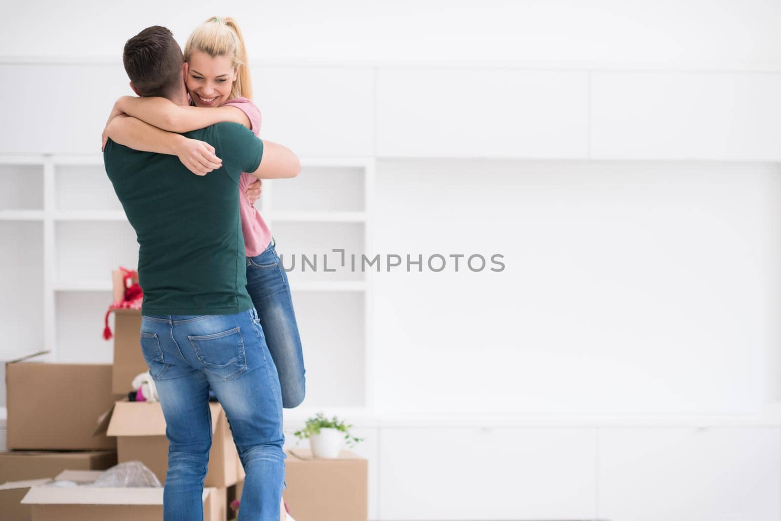 happy Young couple moving in new house by dotshock