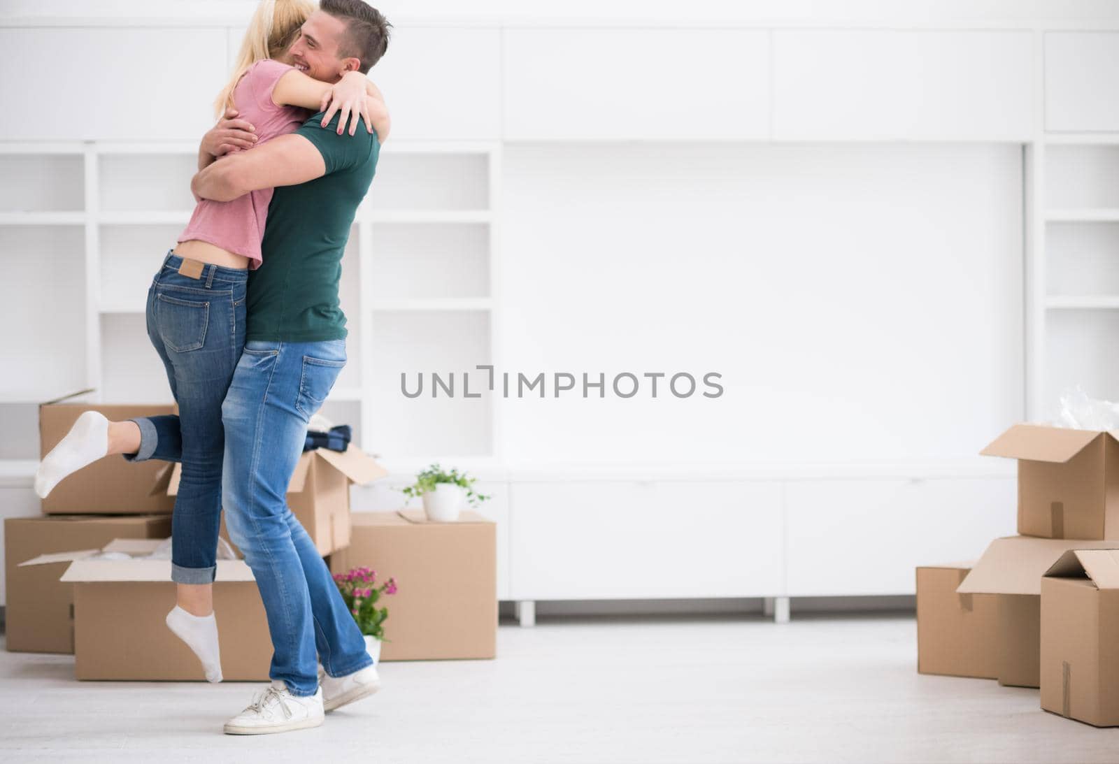 happy Young couple moving in new house by dotshock