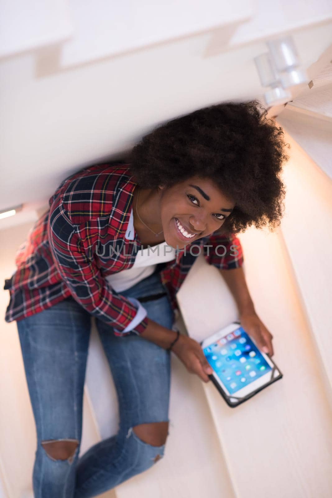 black woman using her electronic tablet by dotshock