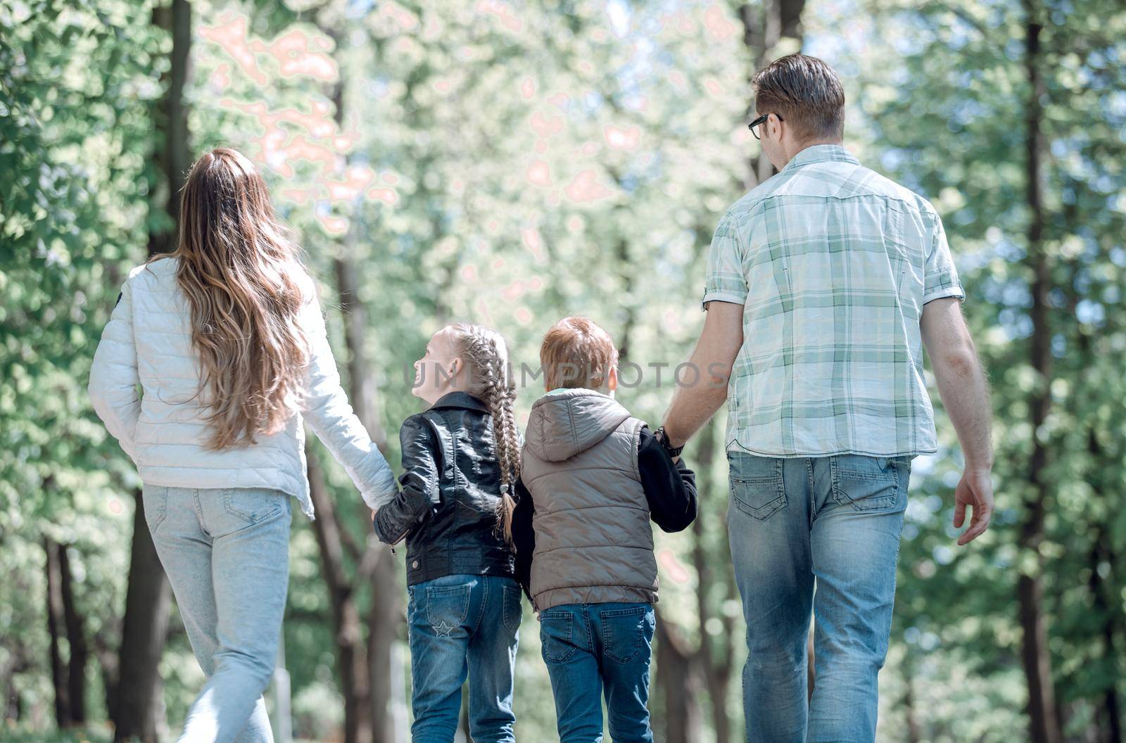 children and parents on a walk in the Park.the concept of family entertainment