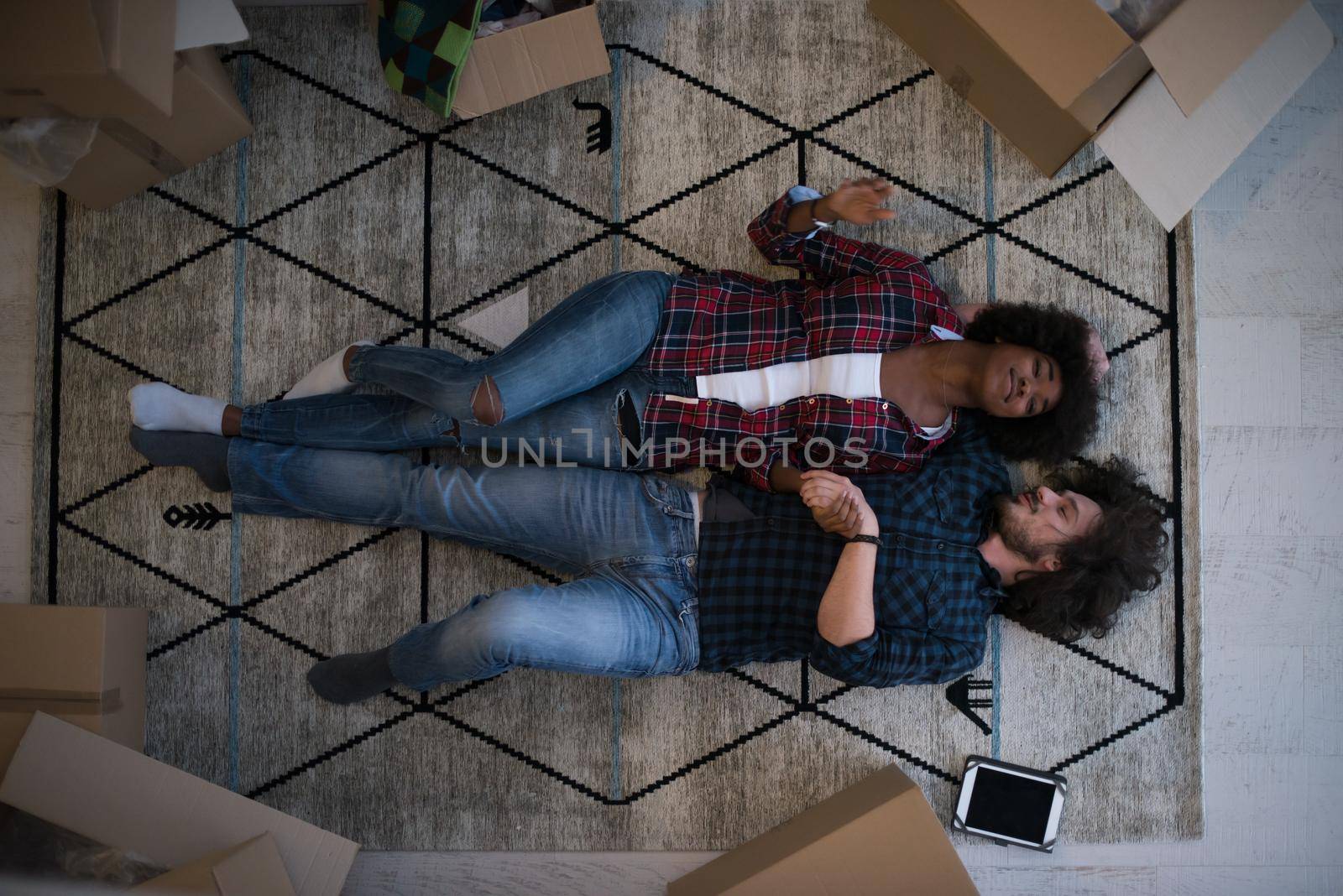 Top view of attractive young multiethnic couple by dotshock