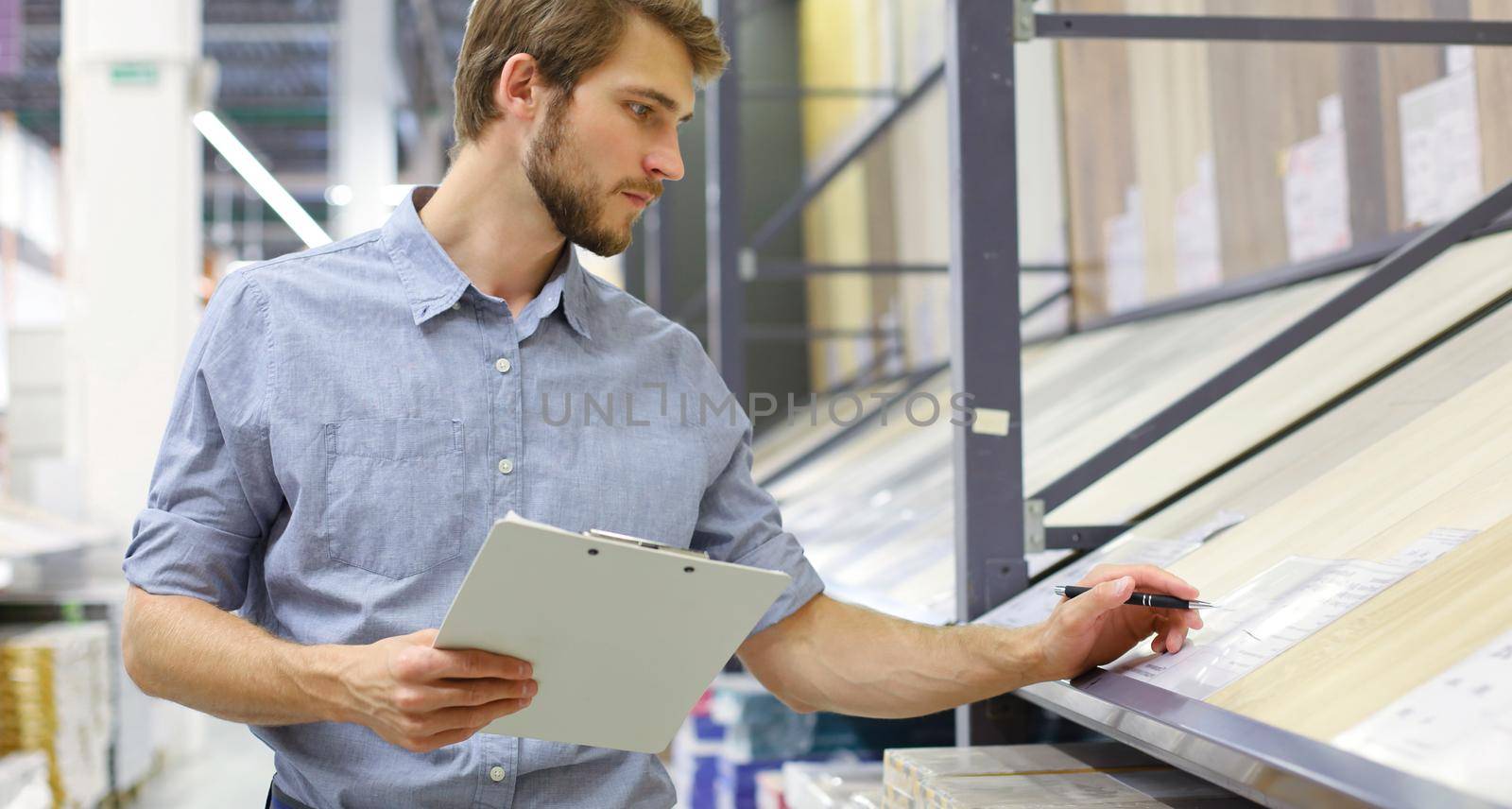 Manager use his tablet for online checking products available