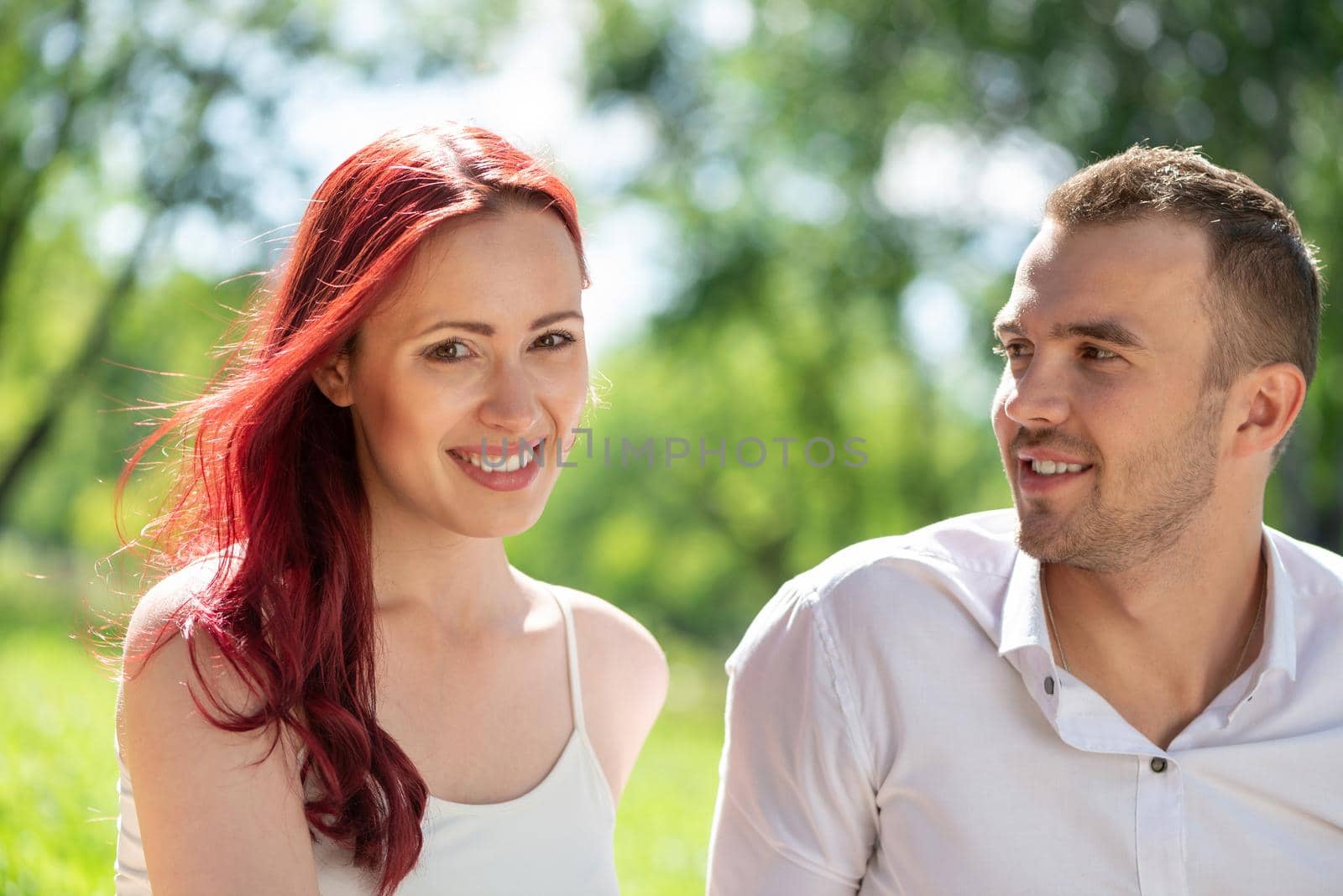 Young couple on a date in the park by adam121