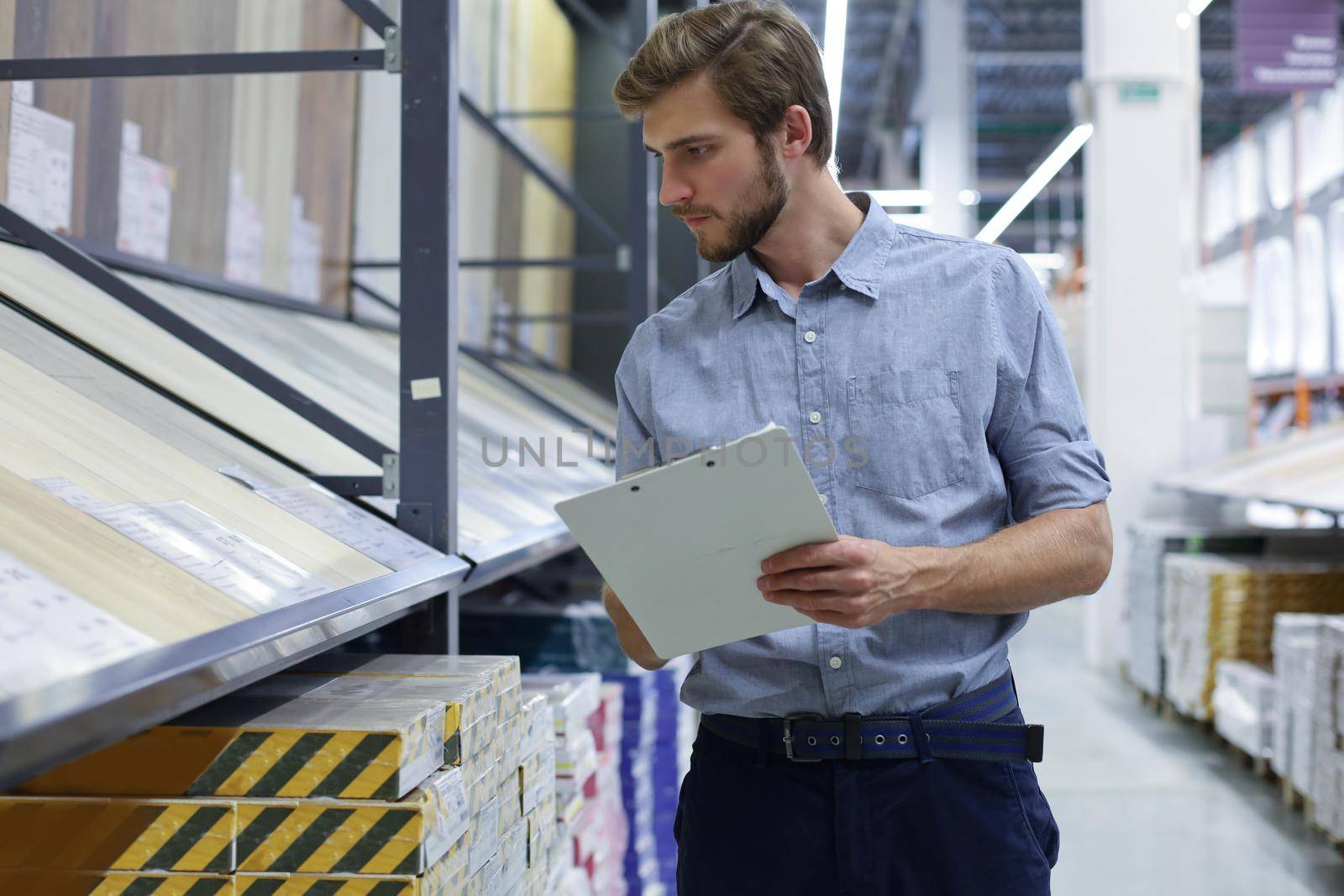 Manager use his tablet for online checking products available