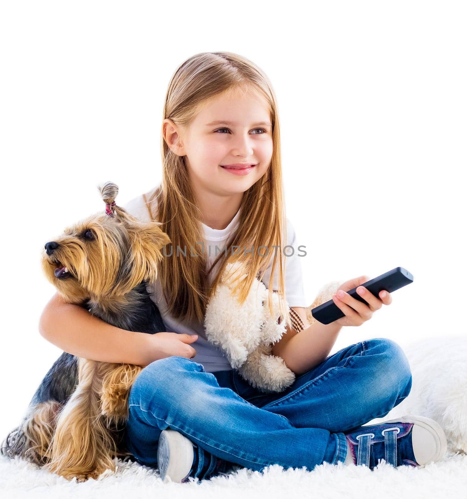 Cute girl and her dog switching channels with tv remote isolated on white