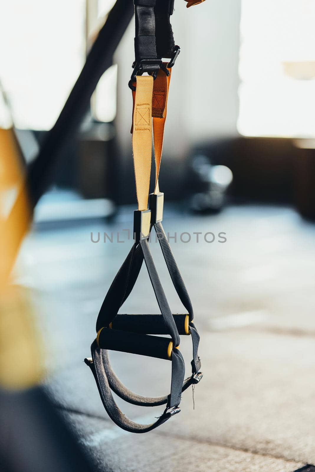 Functional training equipment and sport accessories. Close up shot of fitness trx straps by friendsstock