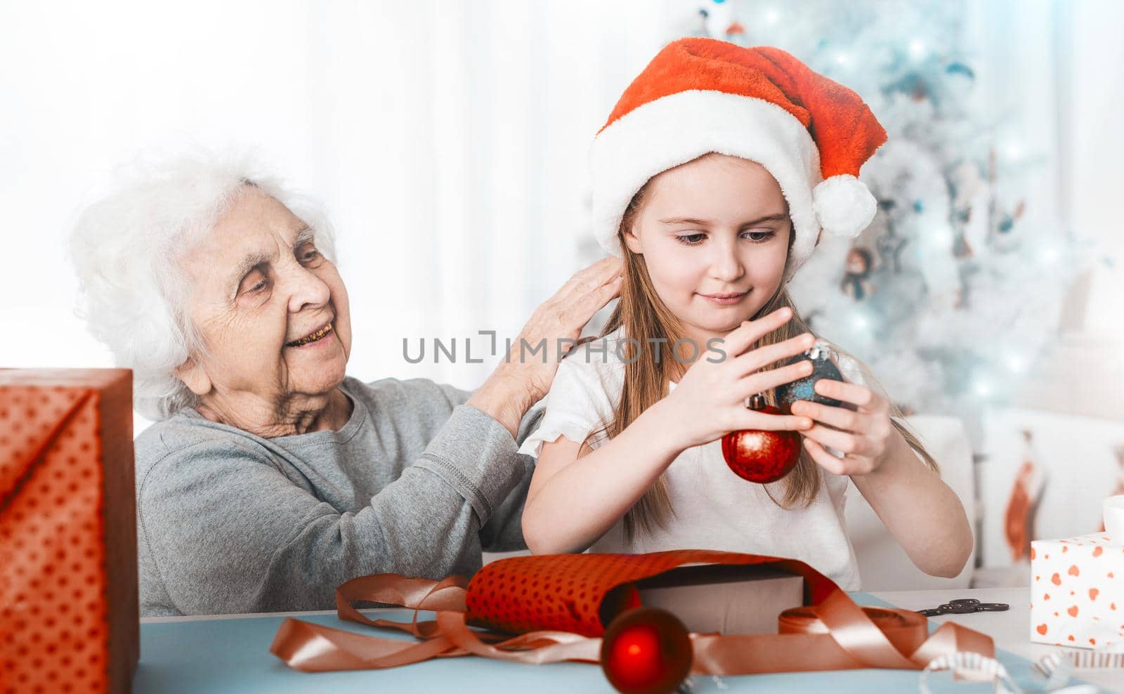 Granddaughter sit with grandma holding balls by GekaSkr