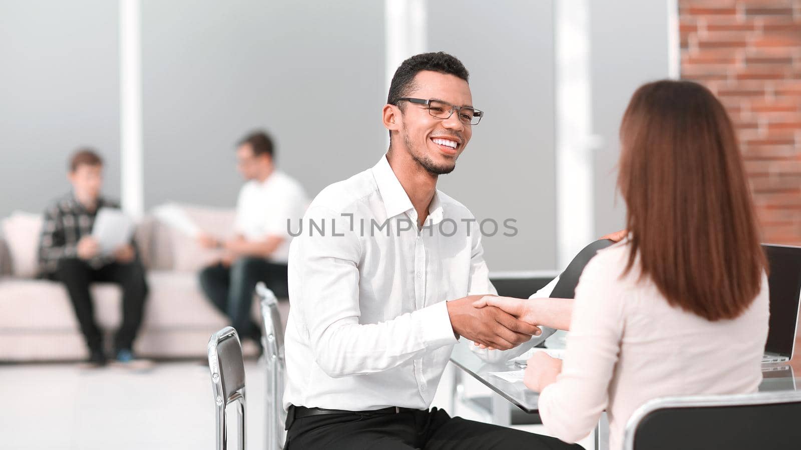 business people shake hands at a business meeting . photo with copy space