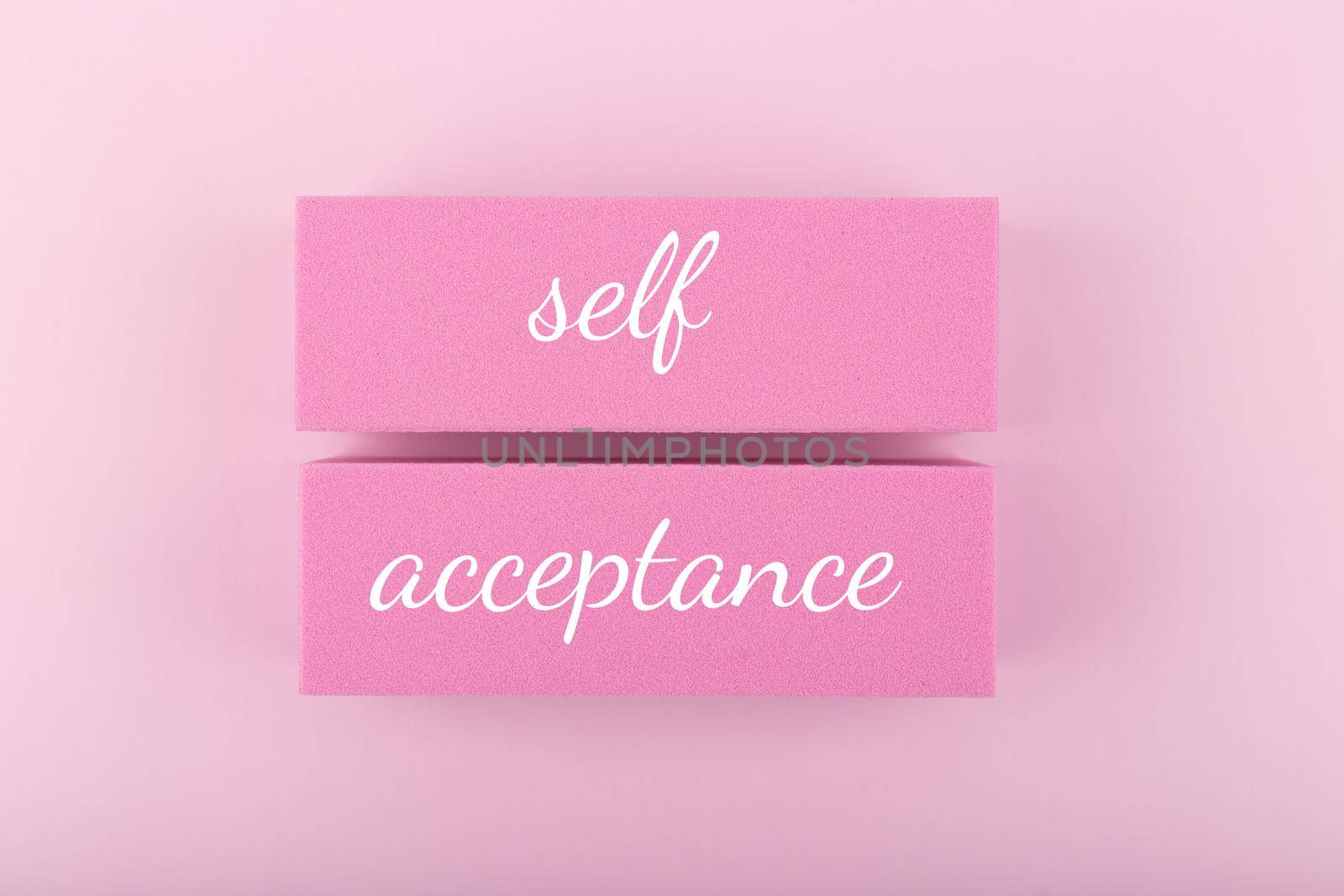 Trendy minimal self acceptance creative concept in monochromatic pink colors. Mental health, self acceptance, self care and respect or body positive. Simple elegant composition