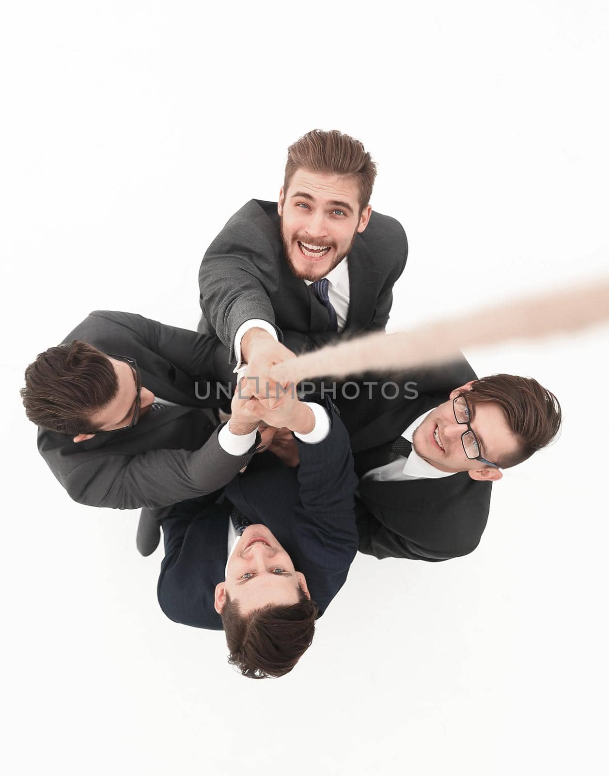 view from the top.smiling business team holding the rope.the concept of teamwork