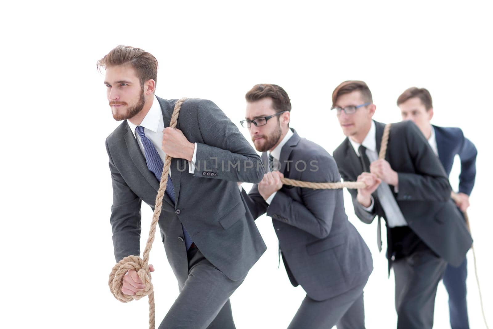 closeup.smiling business team pulls the rope.isolated on white