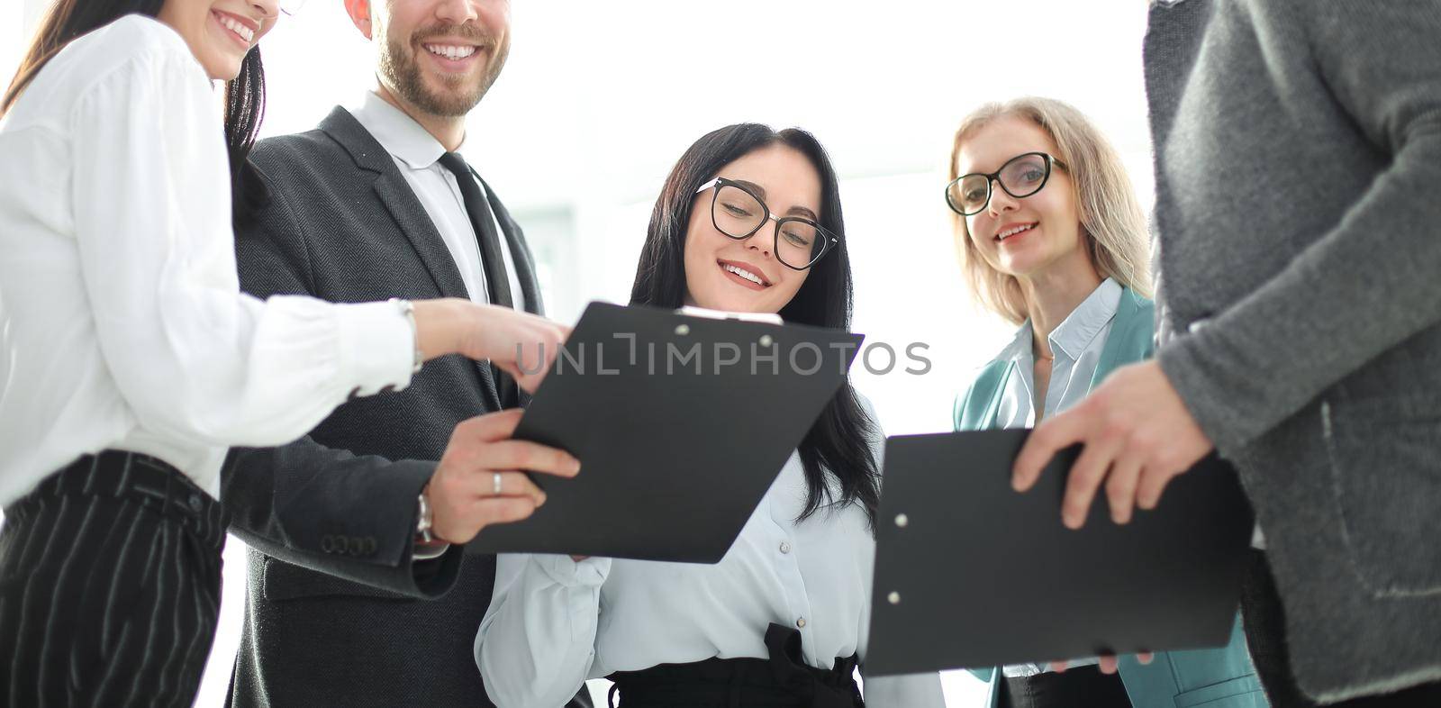 close up. successful business team with business documents. by SmartPhotoLab