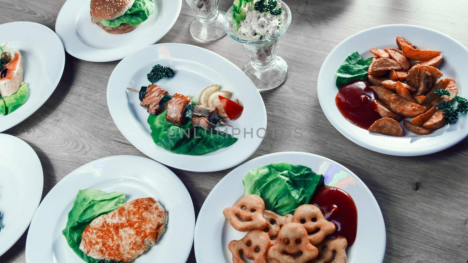 salmon kebab on wooden skewers with fresh vegetables. dishes for a picnic