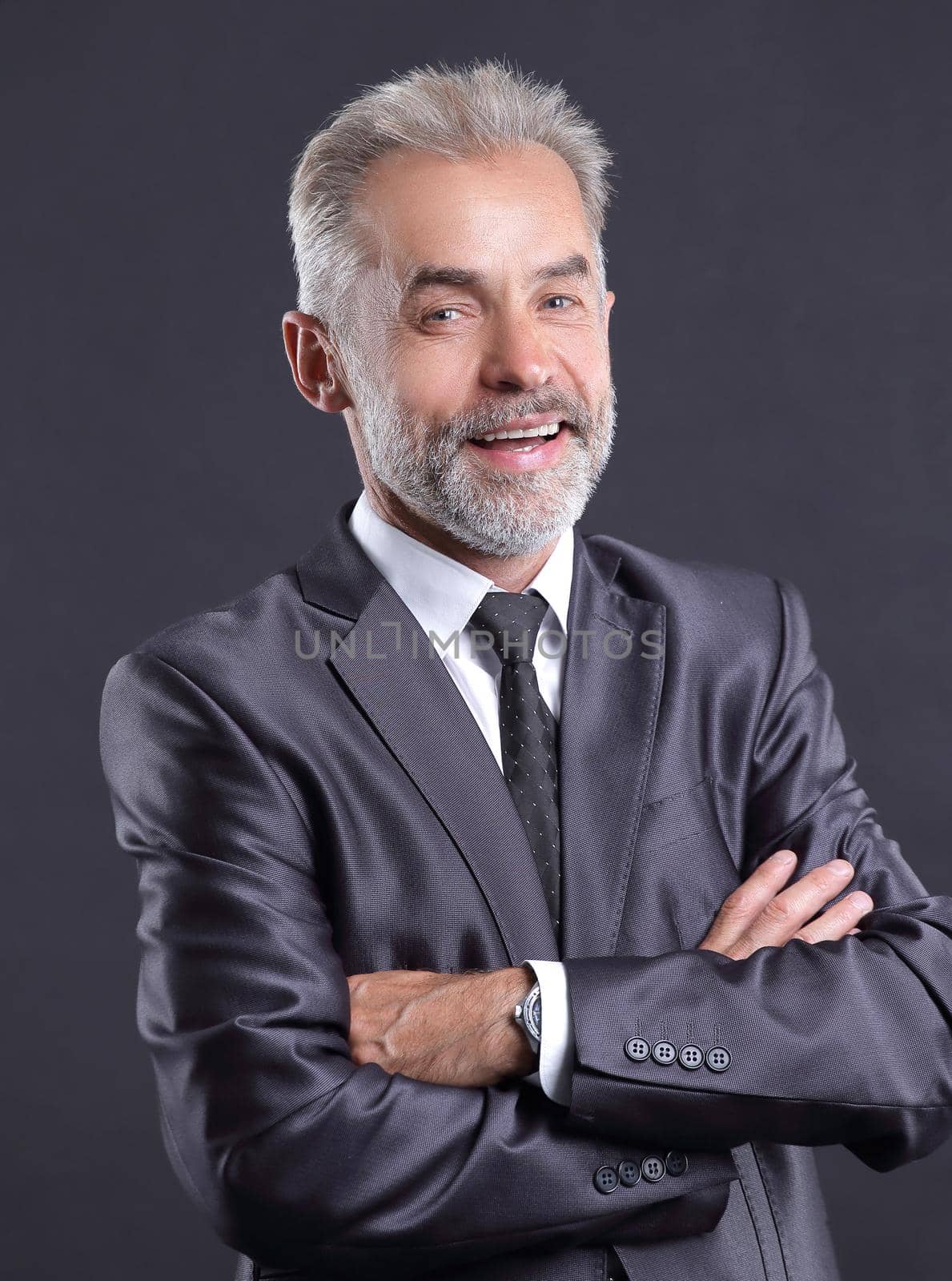 portrait of a senior businessman.isolated on dark background.