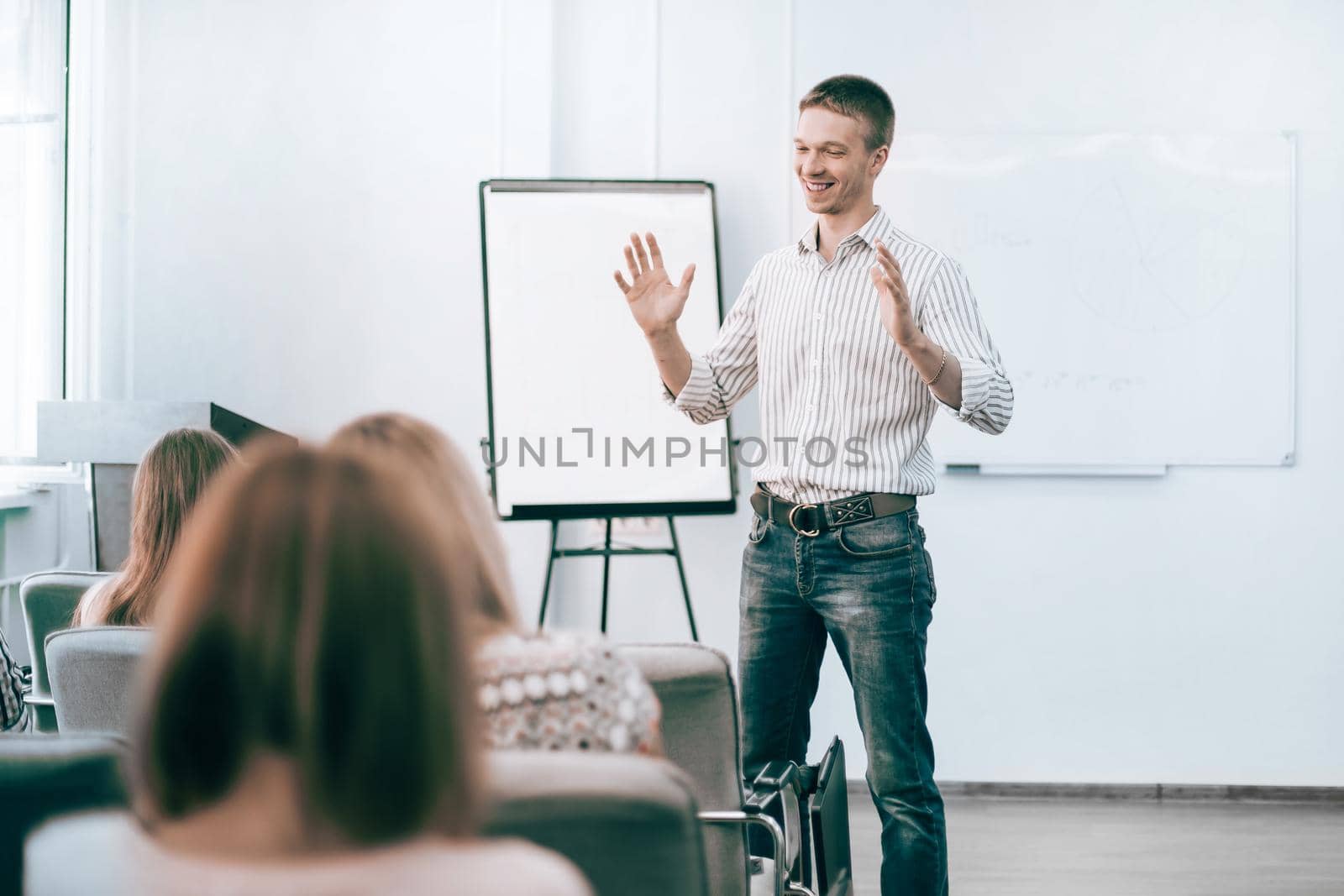 young employee explaining to colleagues his new ideas. business concept