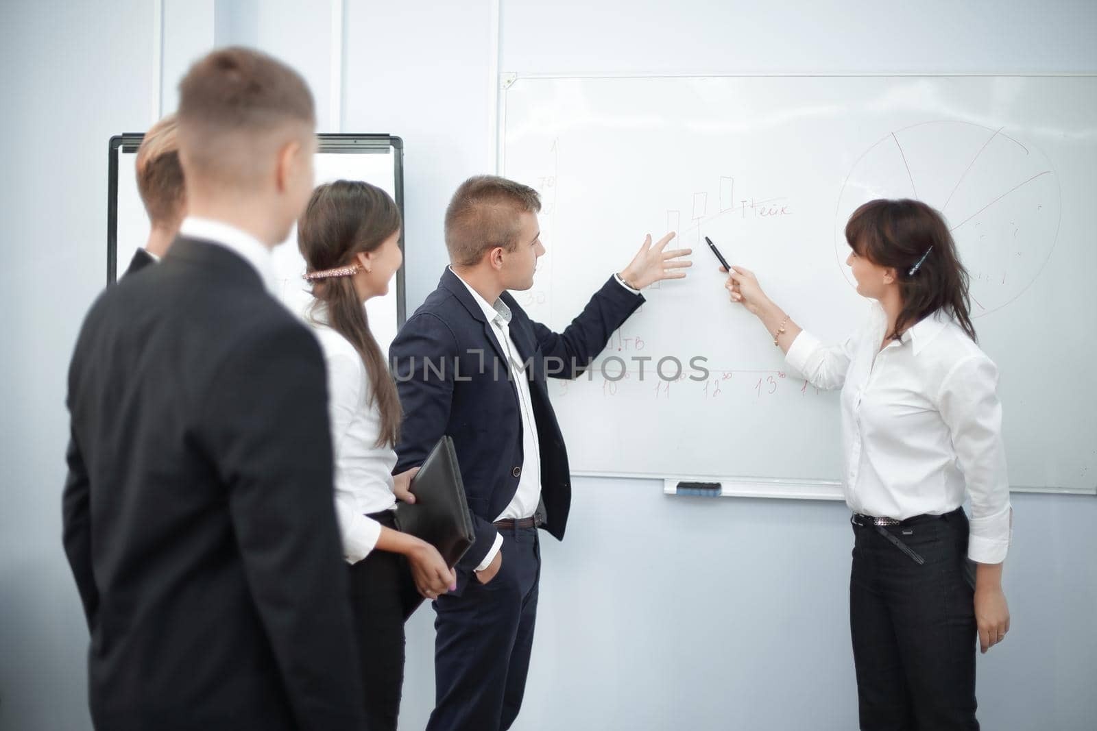 business team and Executive business woman showing on blank screen by SmartPhotoLab