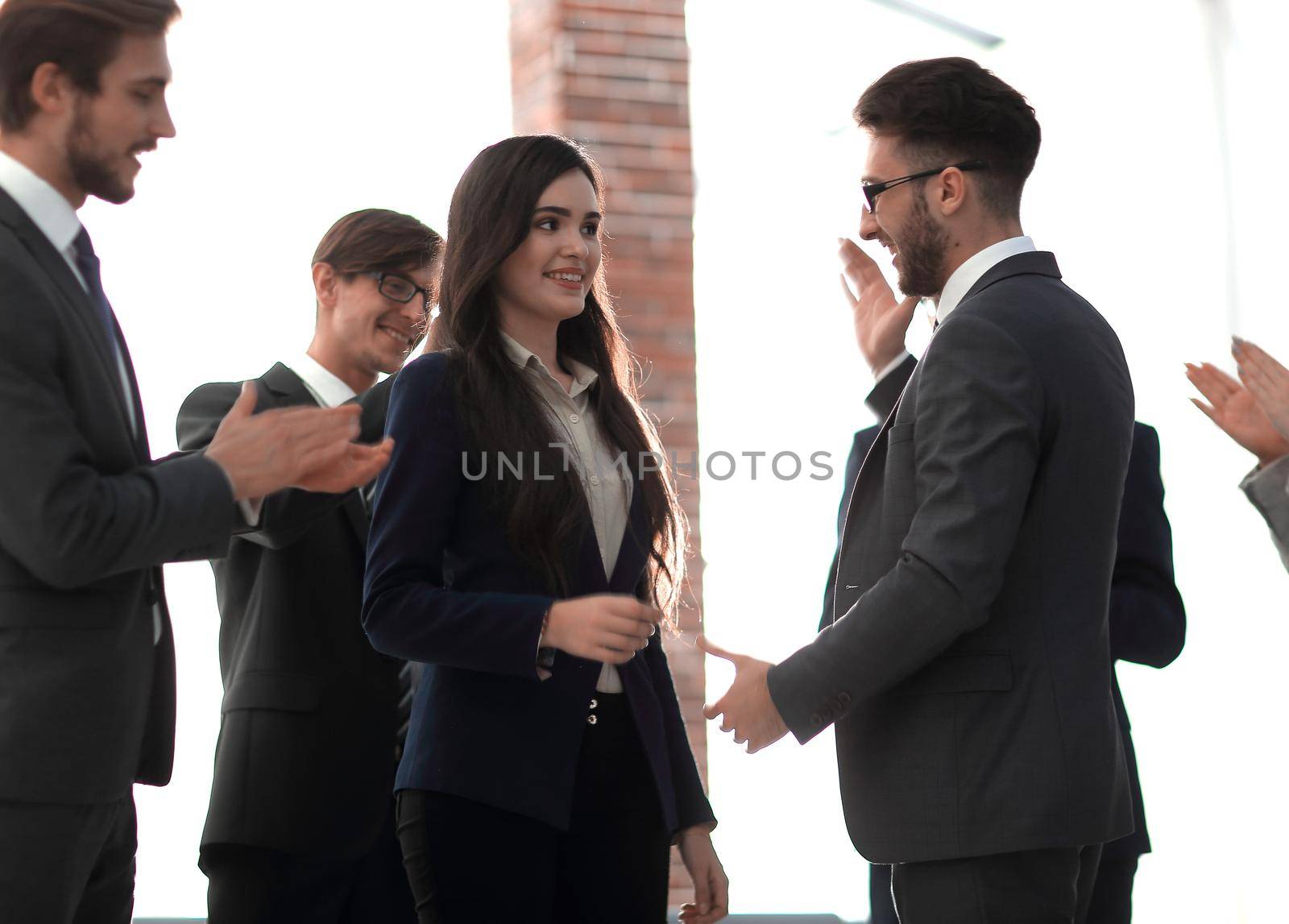 A team of employees congratulating each other.