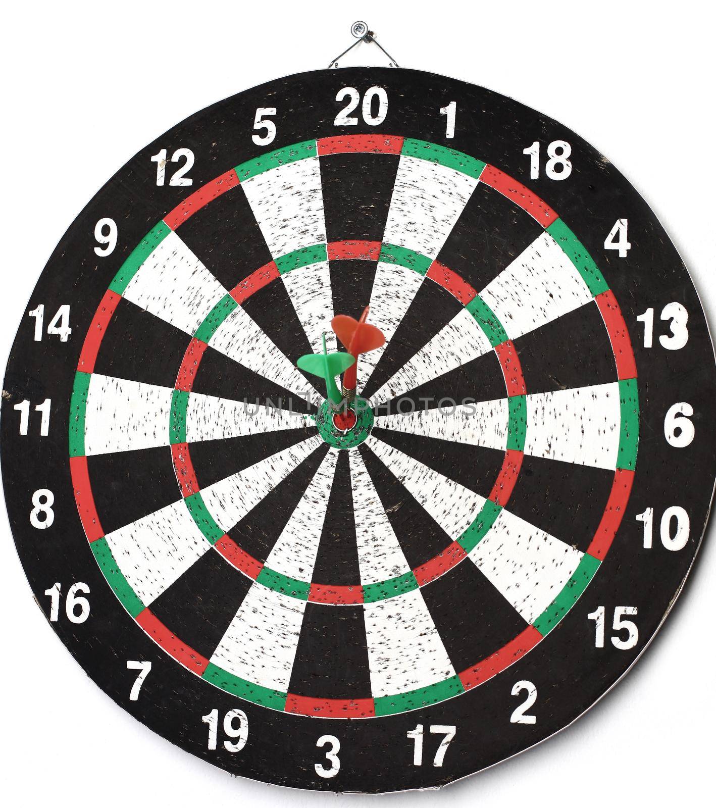 side view.Arrow dart hitting the center of the target dart Board.the concept of purpose.