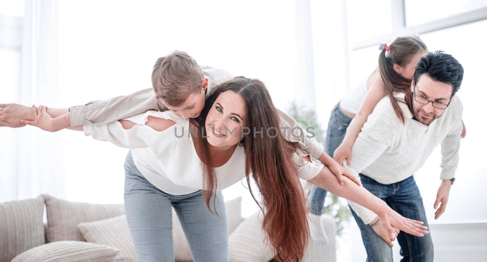 happy parents with their children have fun .photo with copy space