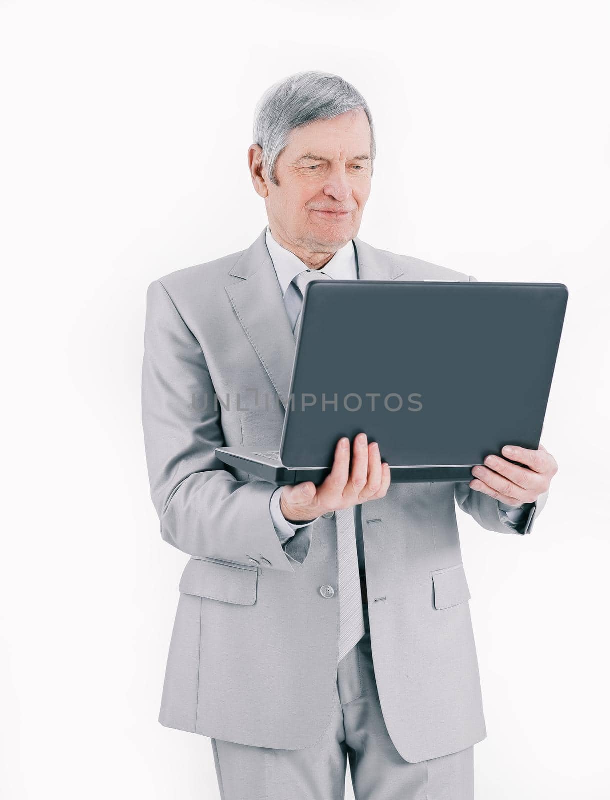 closeup.handsome senior businessman working on laptop.