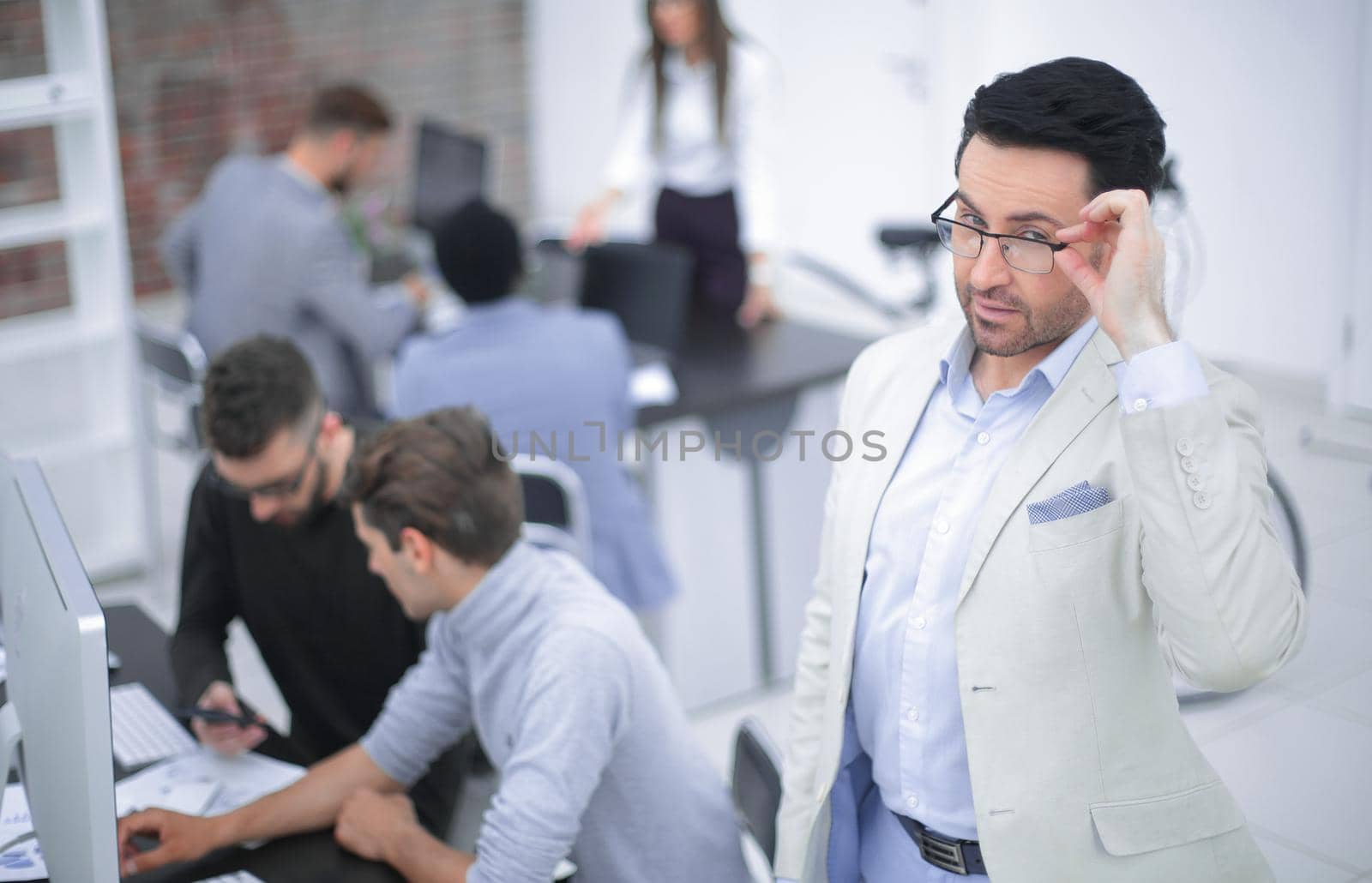 modern businessman standing in office.the concept of success