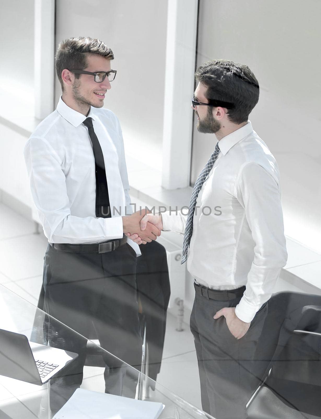 close up.handshake business people in the office.business concept