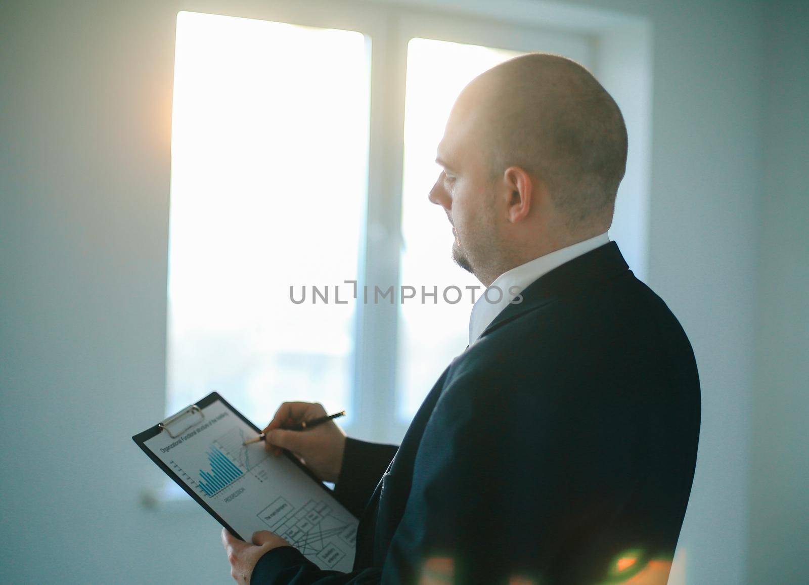 close up.the businessman checks the financial schedule.photo with copy space.