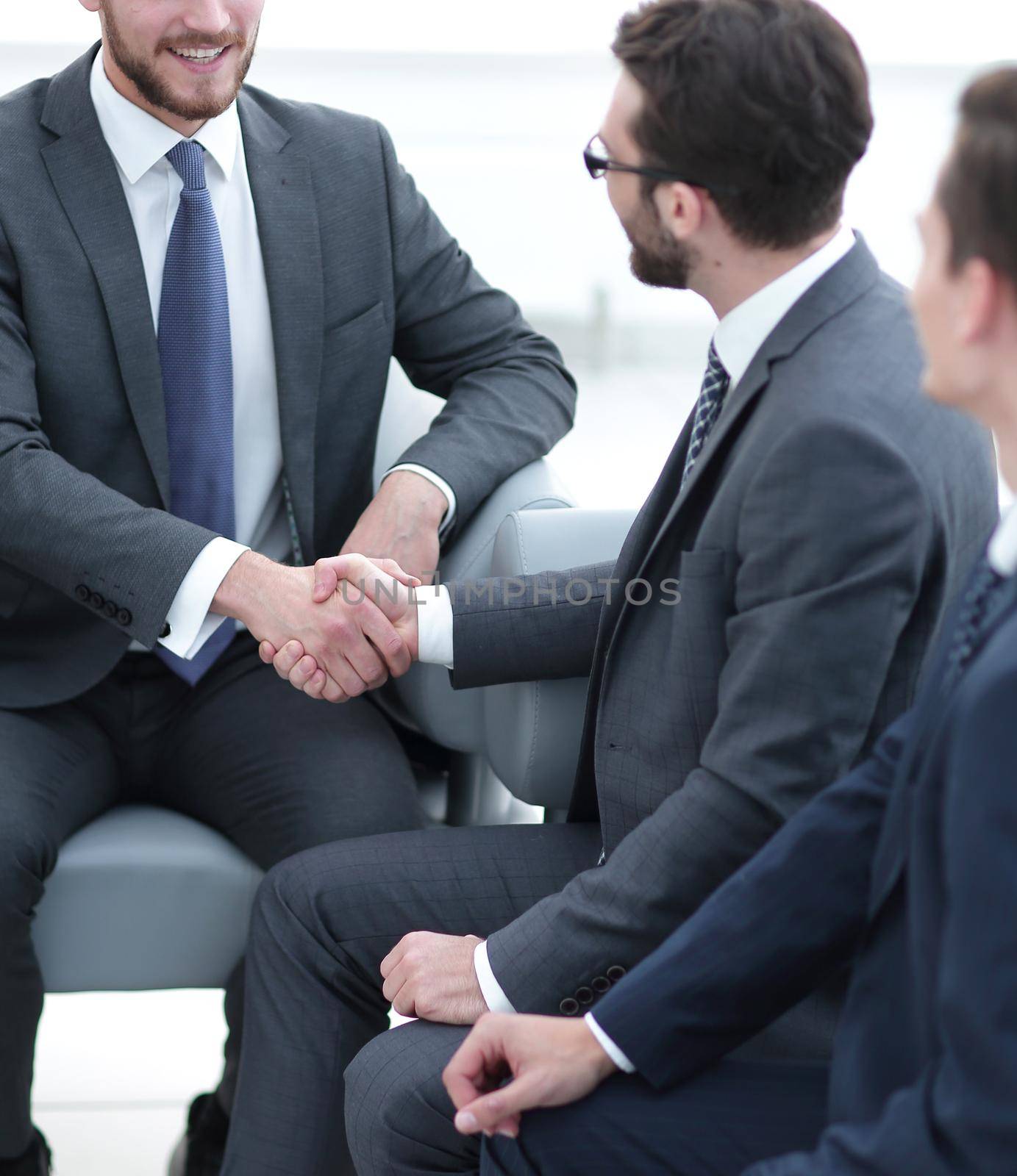 handshake business people in the office. by asdf