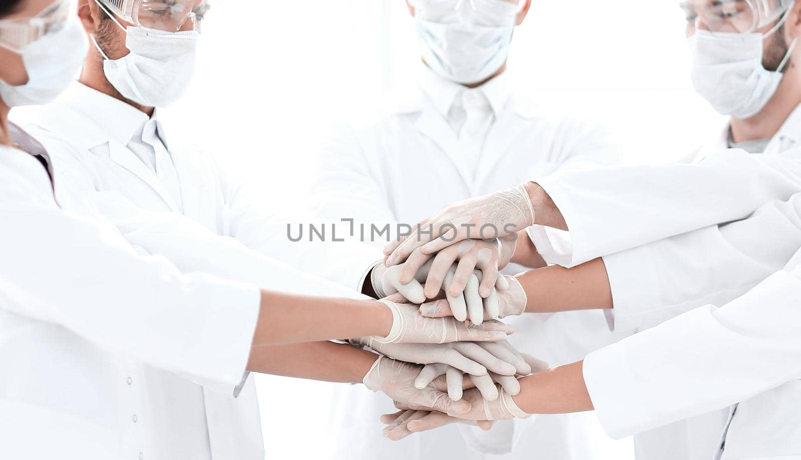 Close-up Photo Of Doctors Stacking Hand With Coworkers by asdf