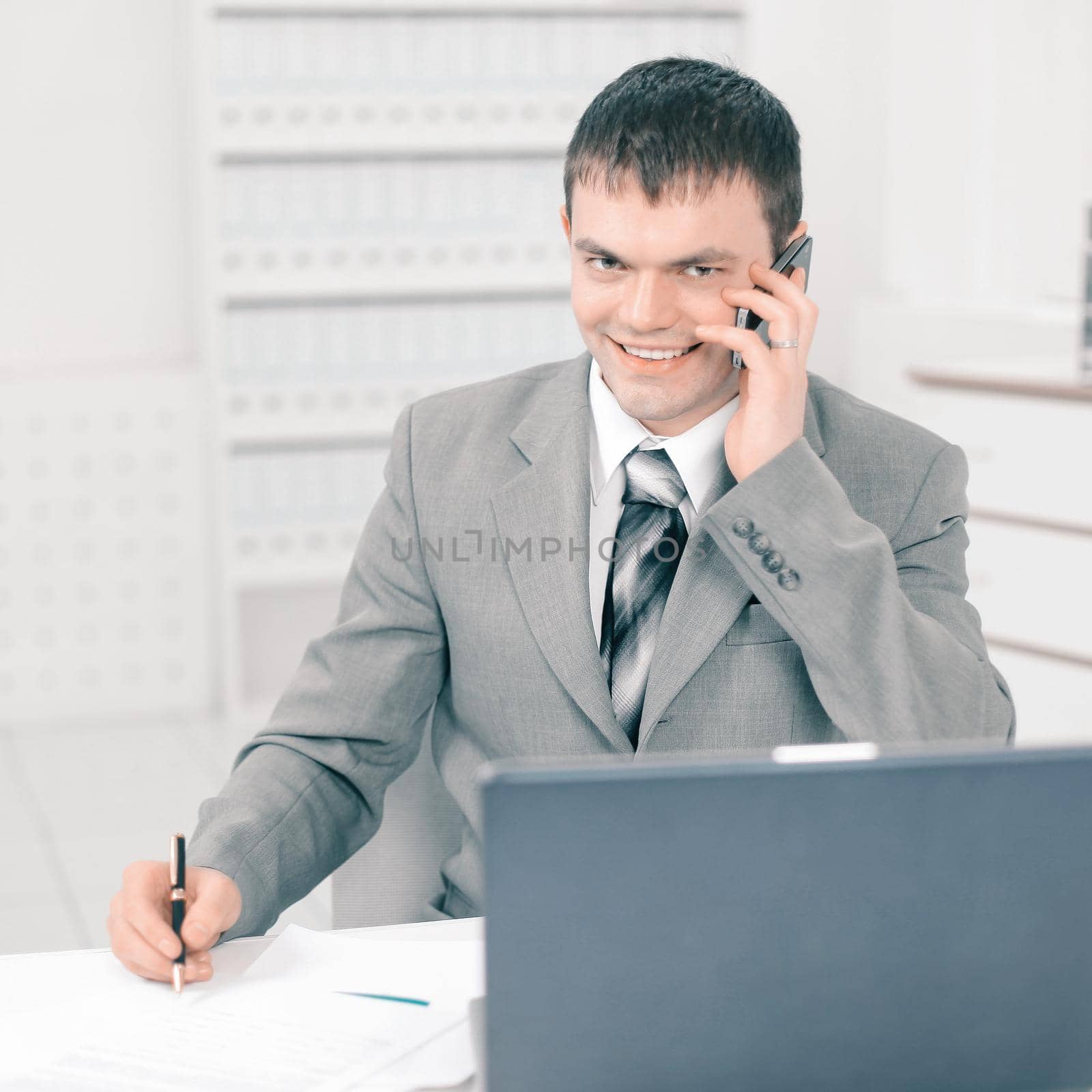 young businessman working in the office.photo with place for text