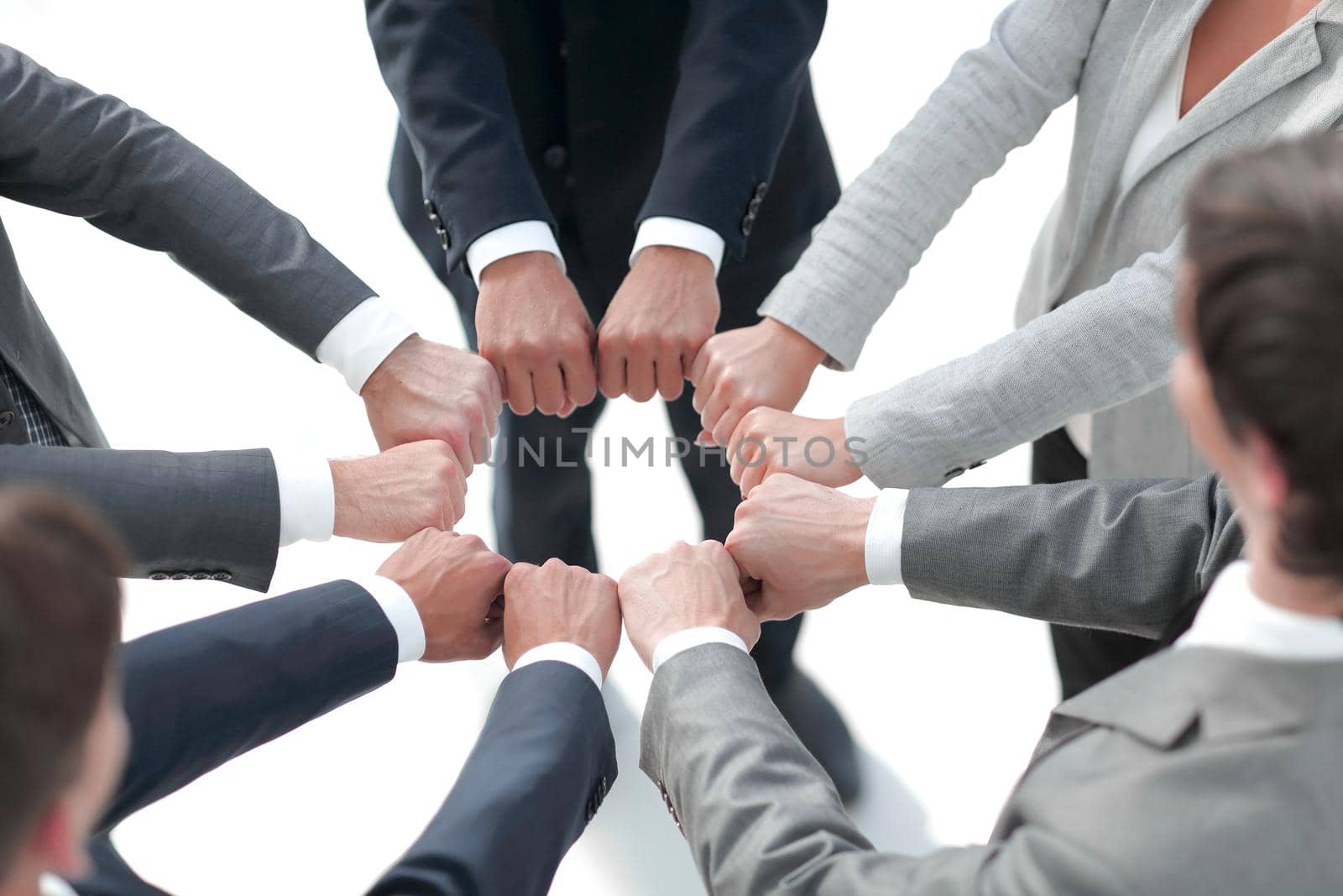 closeup.business people show a circle of hands.the concept of unity