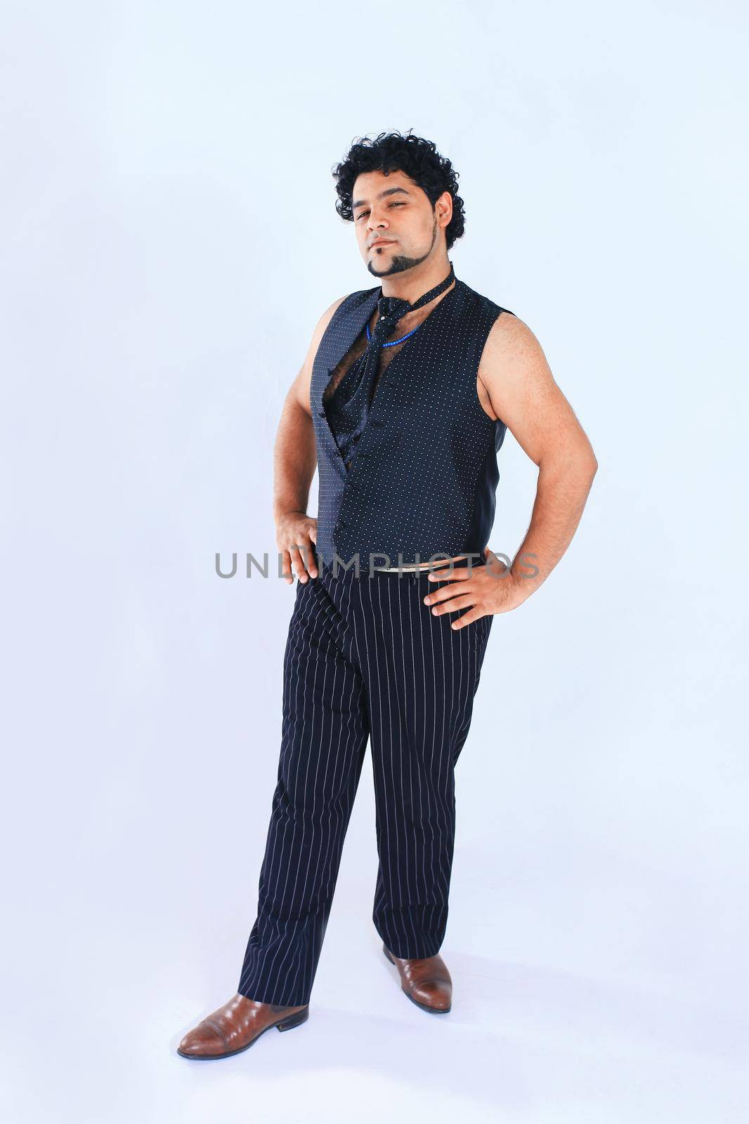 stylish man dancer posing for the camera .isolated on a white background.