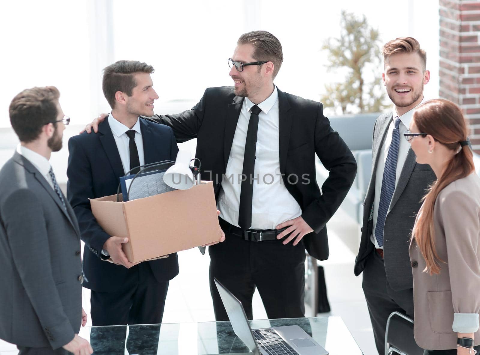 smiling business team meets new employee by asdf