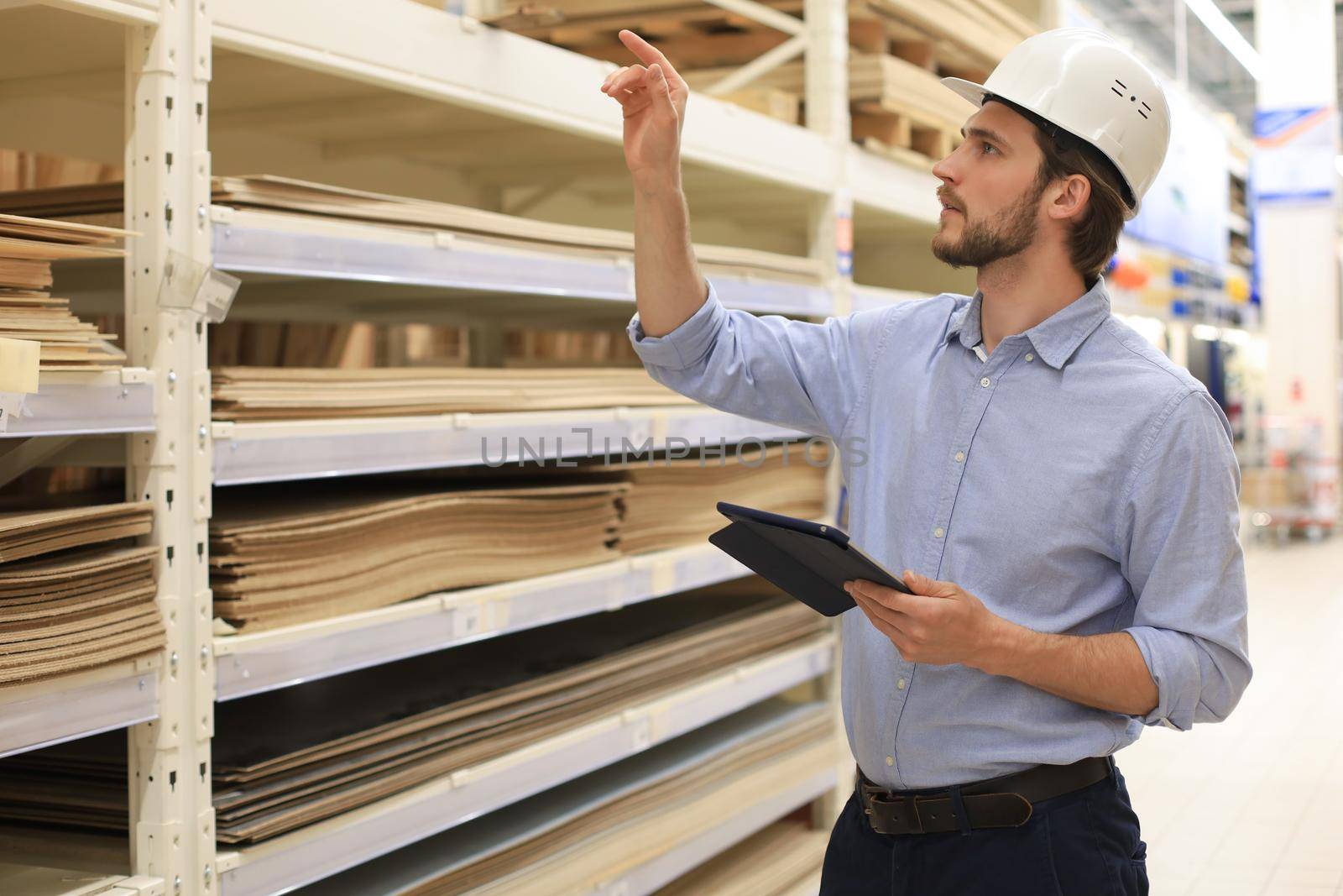 Manager use his tablet for online checking products available