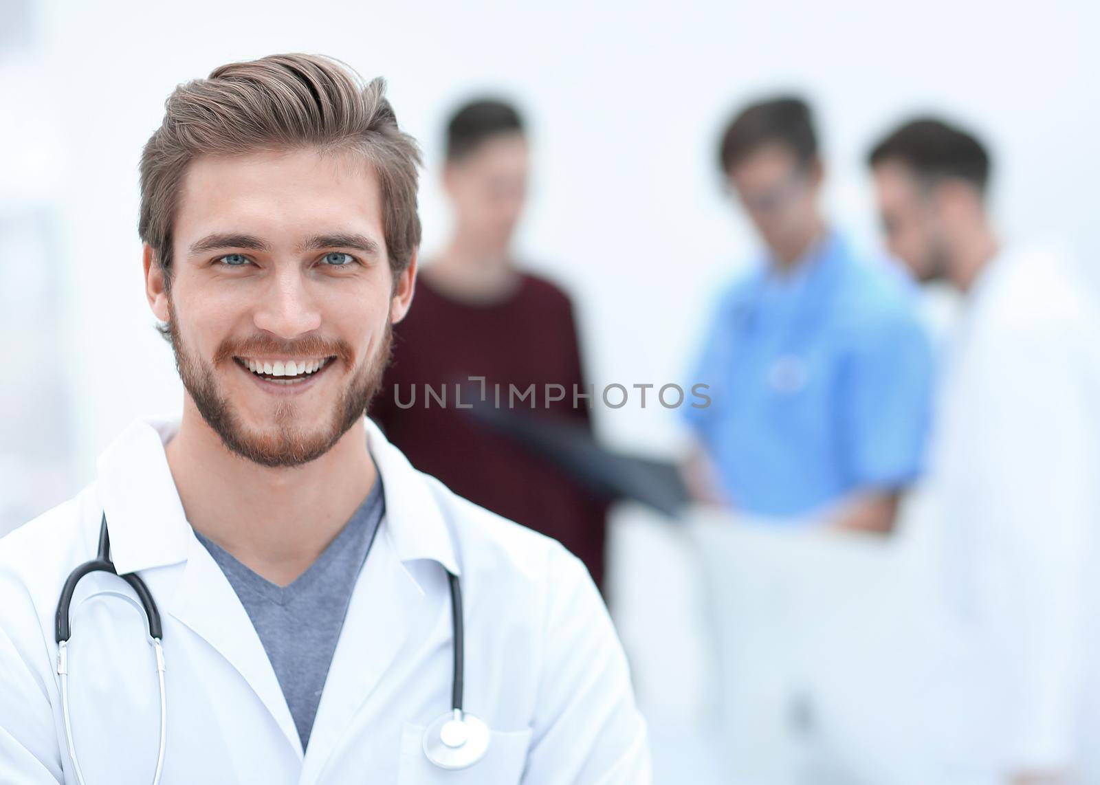 closeup.portrait of a handsome doctor on blurred background office