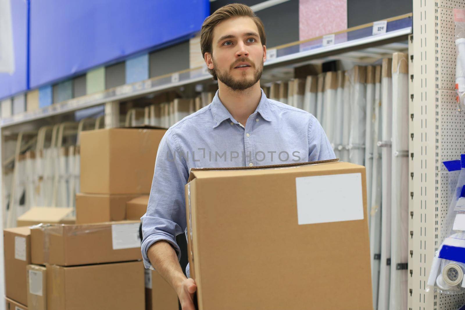 Portrait of a smiling warehouse keeper at work