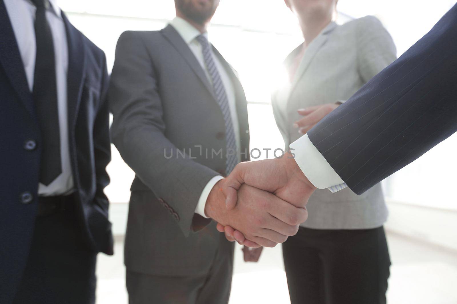 business leader shaking hands with the investor by asdf