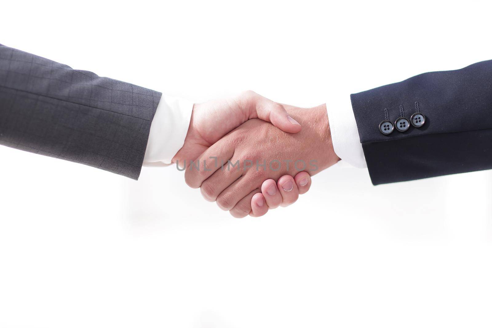 closeup.handshake of business partners on background of office