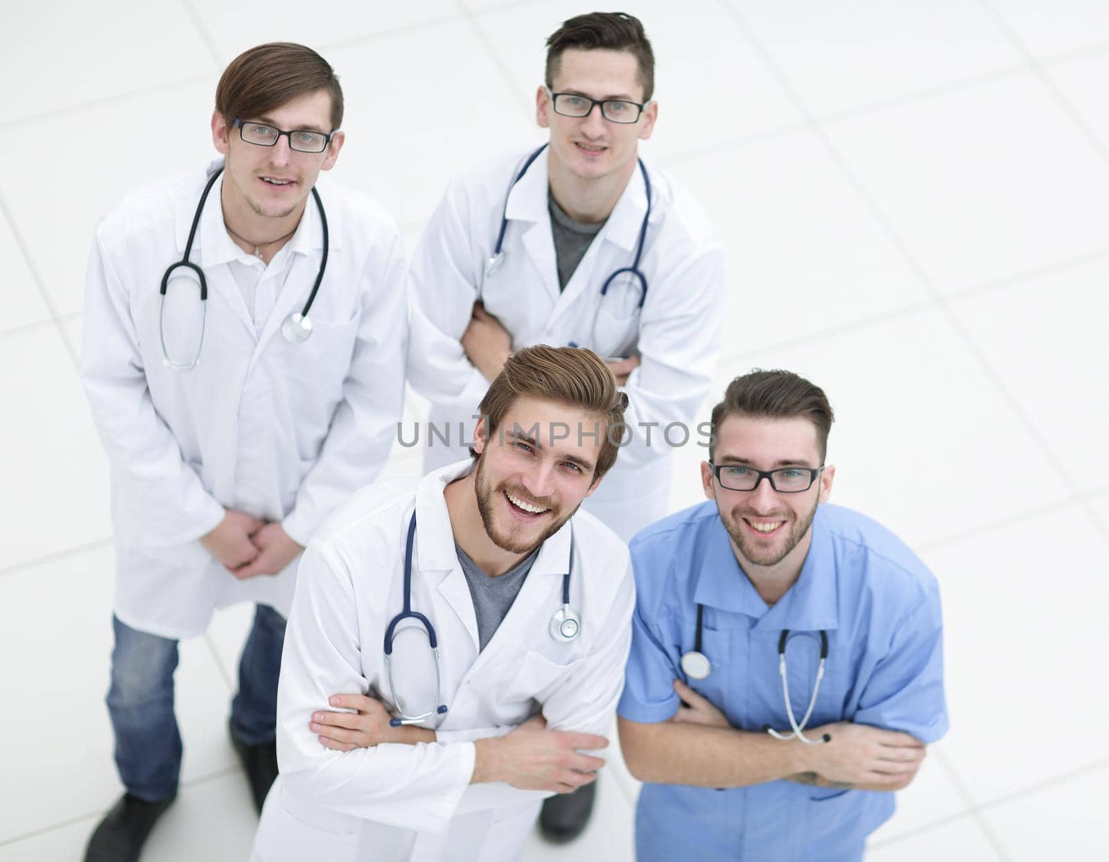 view from the top. the team of doctors looking at the camera.isolated on white