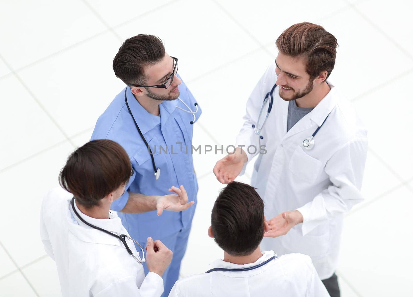 view from the top. team of doctors discussing the problems.isolated on white