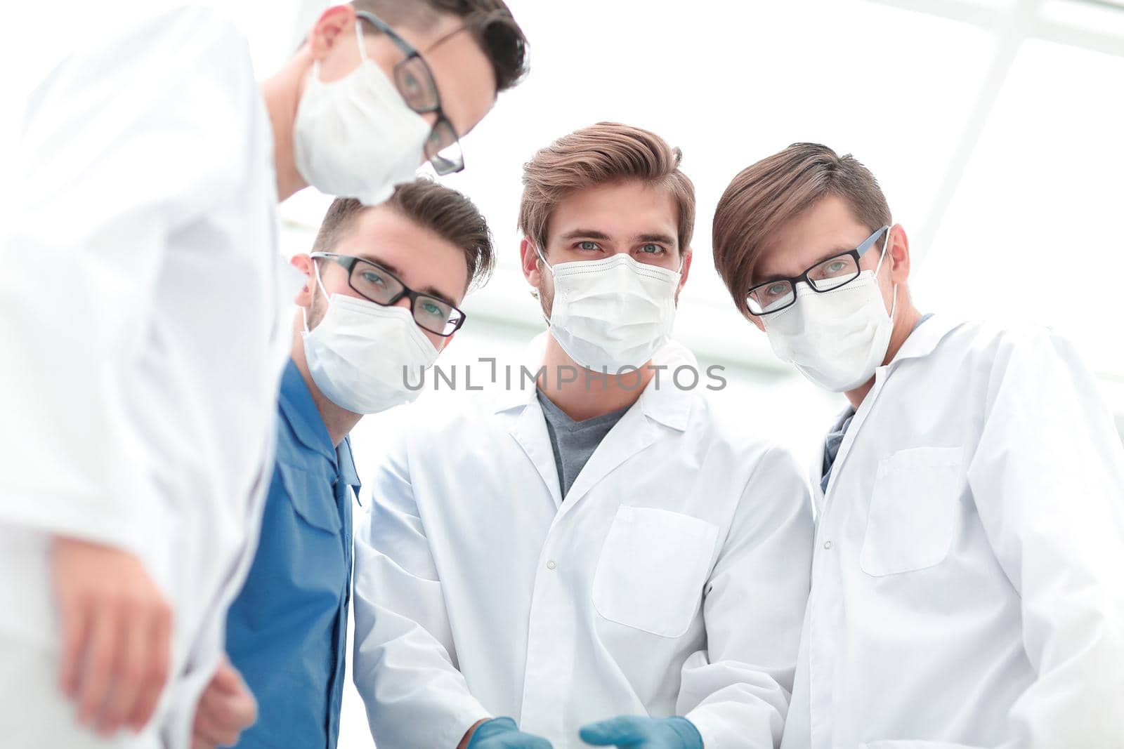 closeup. a team of doctors in protective masks.the concept of professionalism