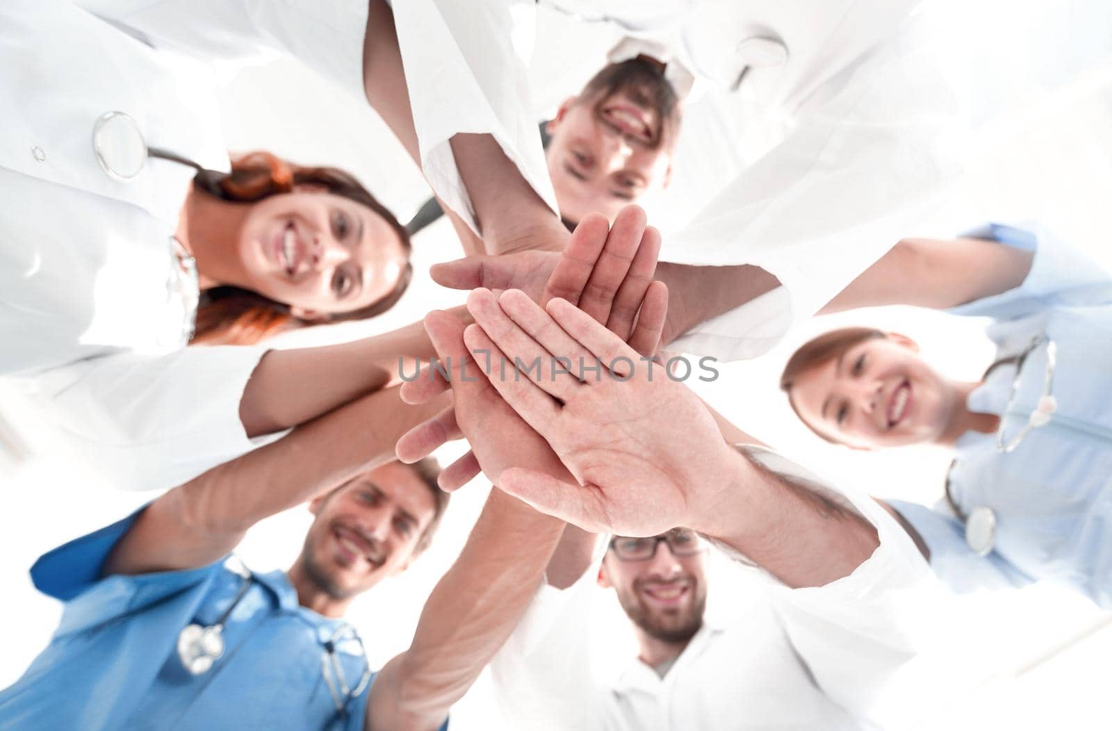 bottom view. close up of a doctors folded their hands together by asdf