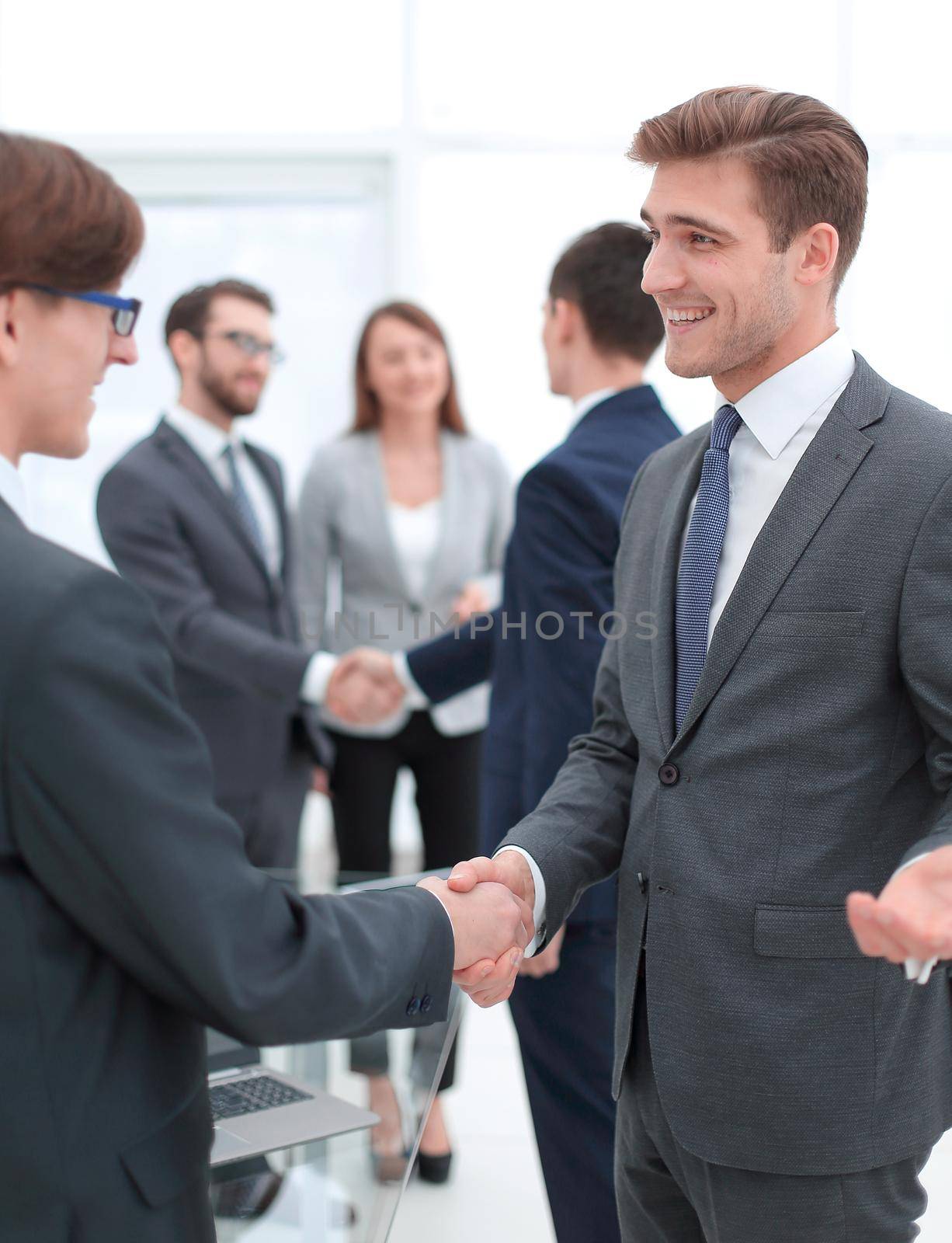 handshake of business partners after the briefing.